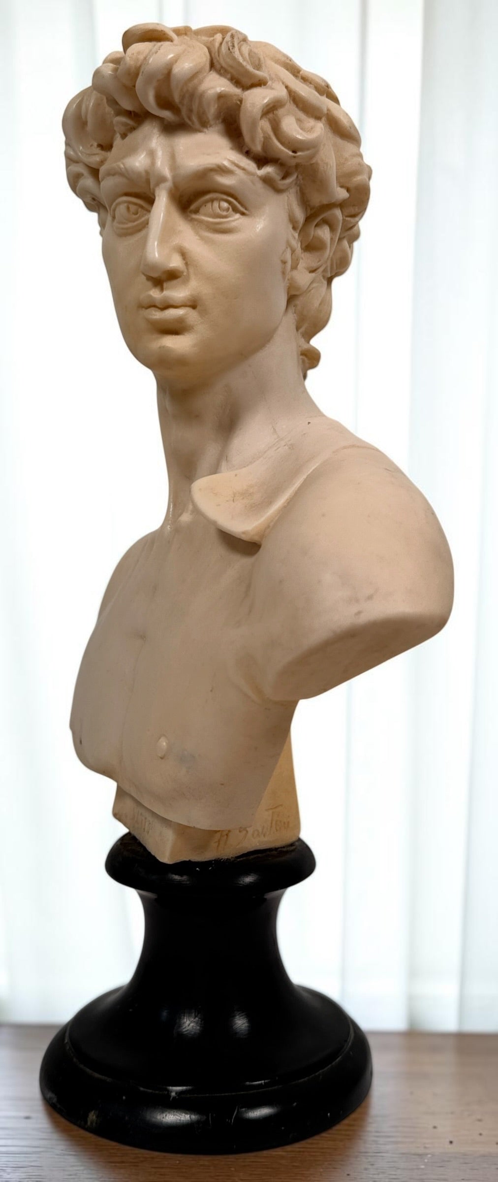 Vintage A. Santini Michelangelo David bust, made in Italy with faux-alabaster finish and black pedestal base. Classic Italian decorative sculpture.