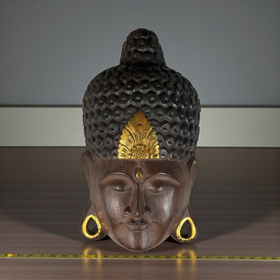Large hand-carved wooden Buddha wall mask with gold accents, 20 inches tall. Southeast Asian decorative carving, hollow-back wall mount.