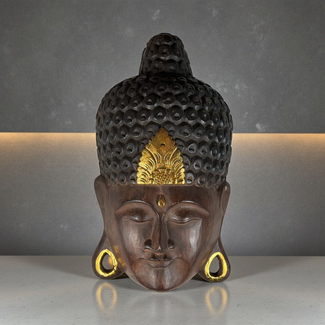 Large hand-carved wooden Buddha wall mask with gold accents, 20 inches tall. Southeast Asian decorative carving, hollow-back wall mount.