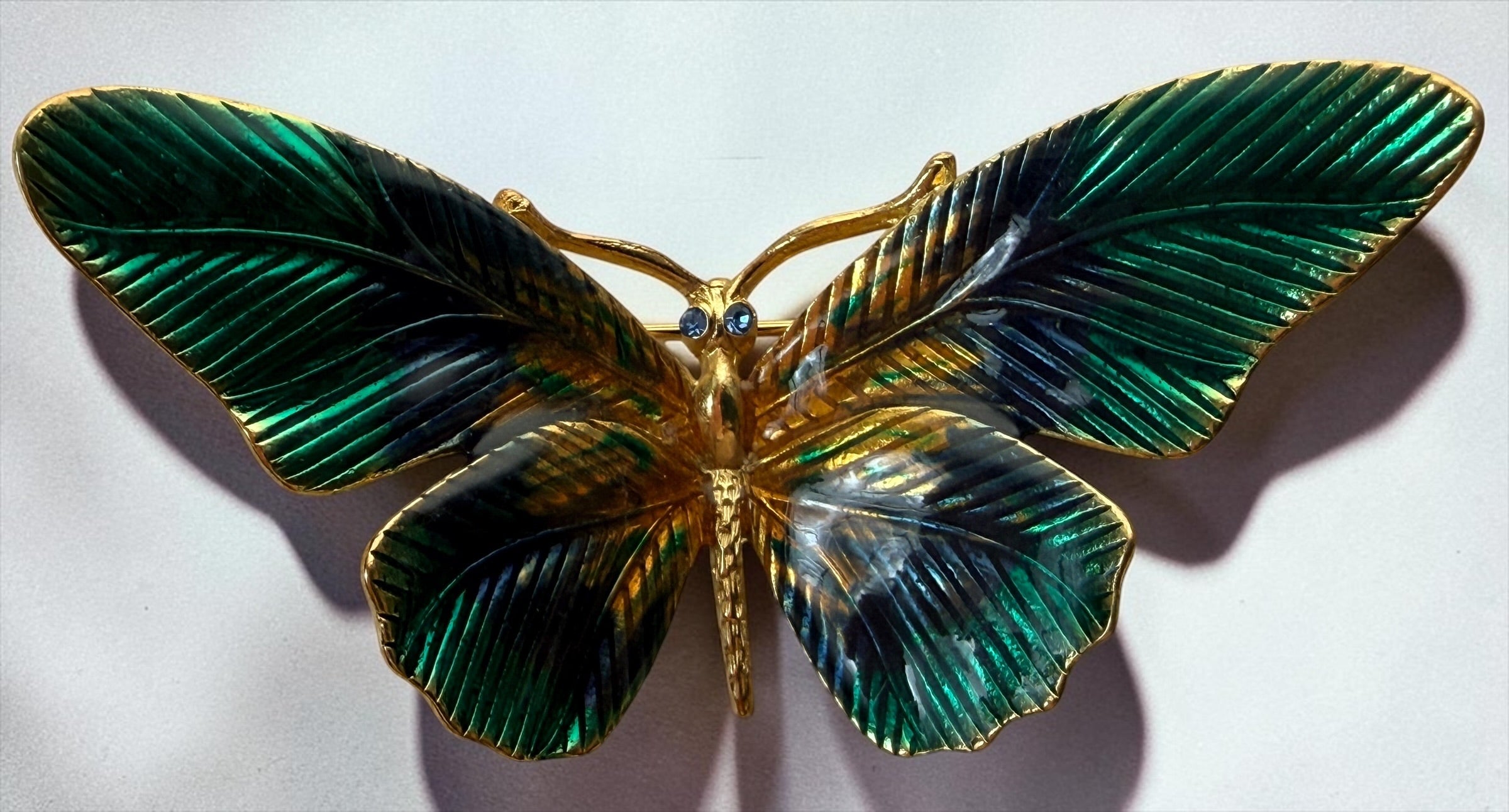 Vintage Erwin Pearl butterfly brooch with emerald and blue enamel wings, gold-tone finish and crystal eyes. Signed E. Pearl vintage costume jewelry.