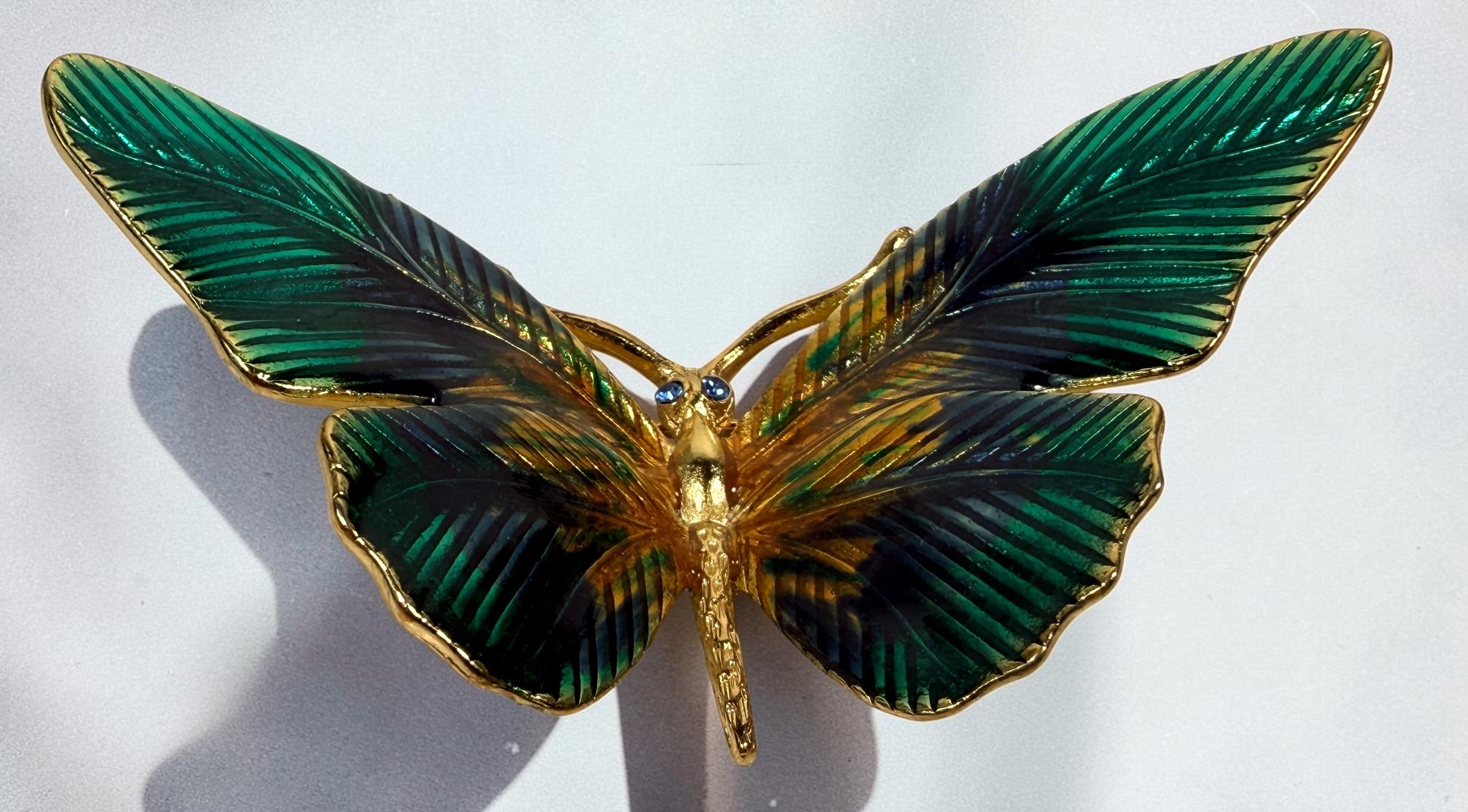 Vintage Erwin Pearl butterfly brooch with emerald and blue enamel wings, gold-tone finish and crystal eyes. Signed E. Pearl vintage costume jewelry.