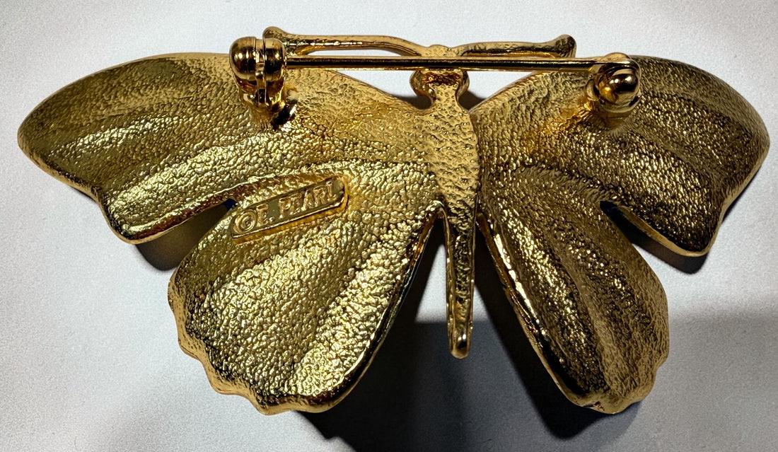 Vintage Erwin Pearl butterfly brooch with emerald and blue enamel wings, gold-tone finish and crystal eyes. Signed E. Pearl vintage costume jewelry.