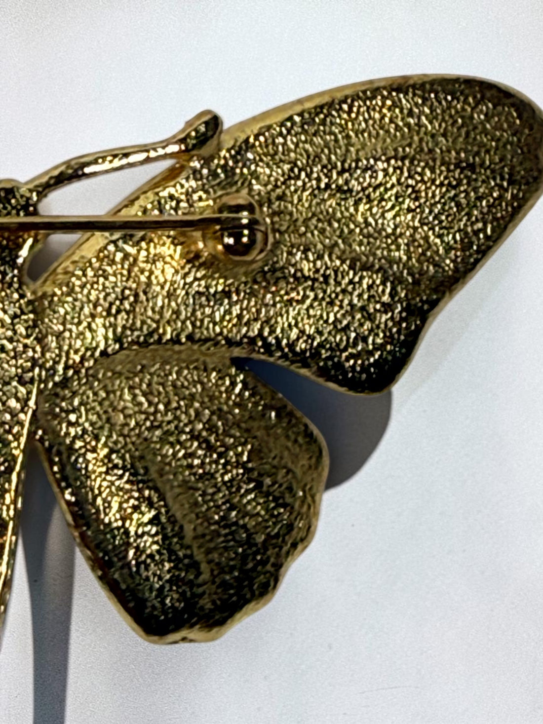 Vintage Erwin Pearl butterfly brooch with emerald and blue enamel wings, gold-tone finish and crystal eyes. Signed E. Pearl vintage costume jewelry.