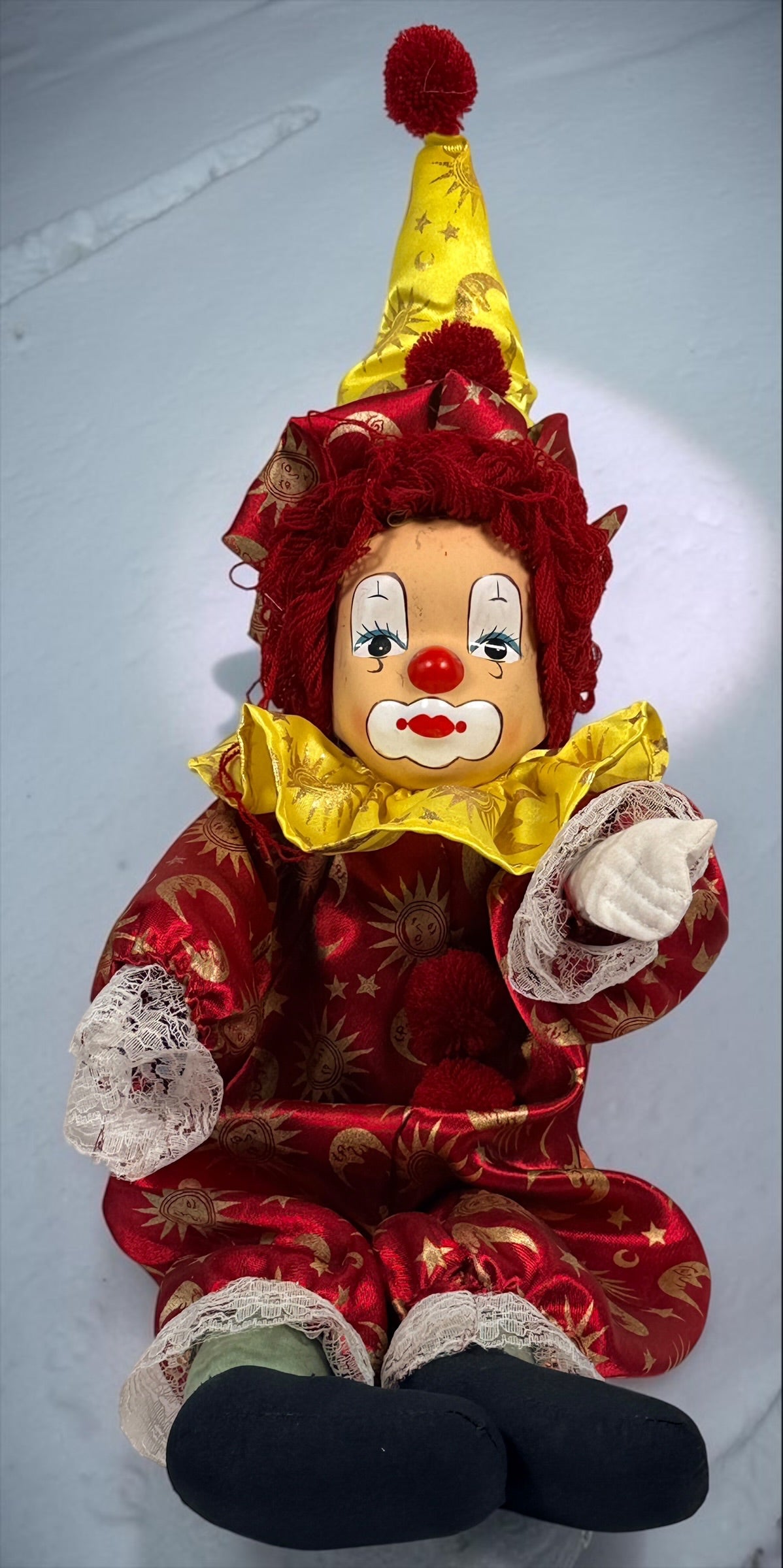 SEO Meta Description: Vintage 12-inch Pierrot clown doll with red and gold celestial costume, yarn hair and painted face. Distinctive collectible circus décor.