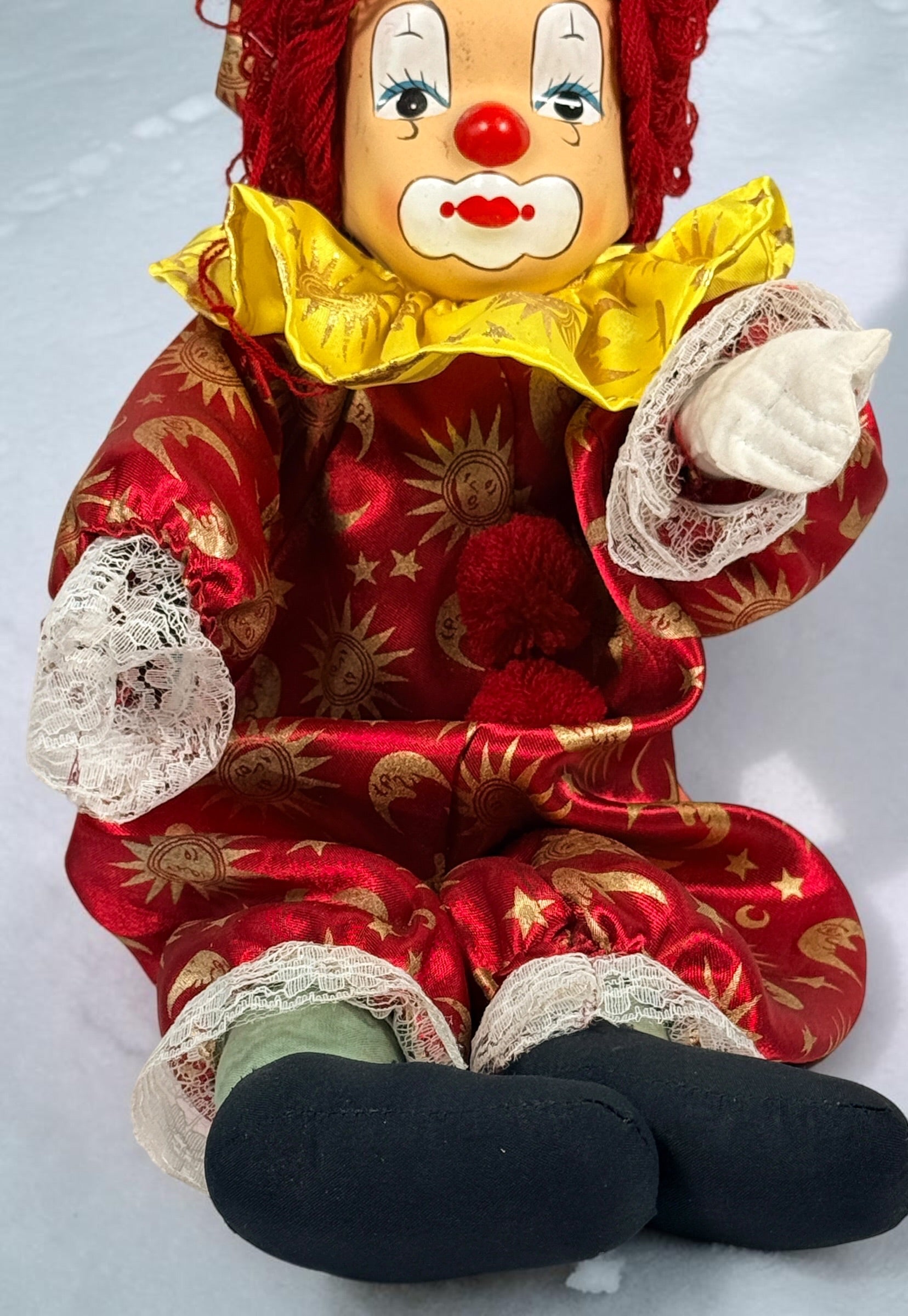SEO Meta Description: Vintage 12-inch Pierrot clown doll with red and gold celestial costume, yarn hair and painted face. Distinctive collectible circus décor.