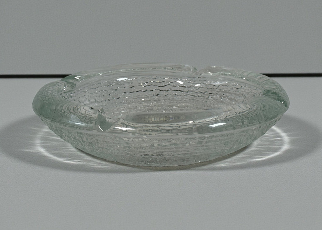 Vintage Iittala Ultima Thule glass ashtray by Tapio Wirkkala, 8 inch diameter. Iconic Finnish modernist pressed glass design.