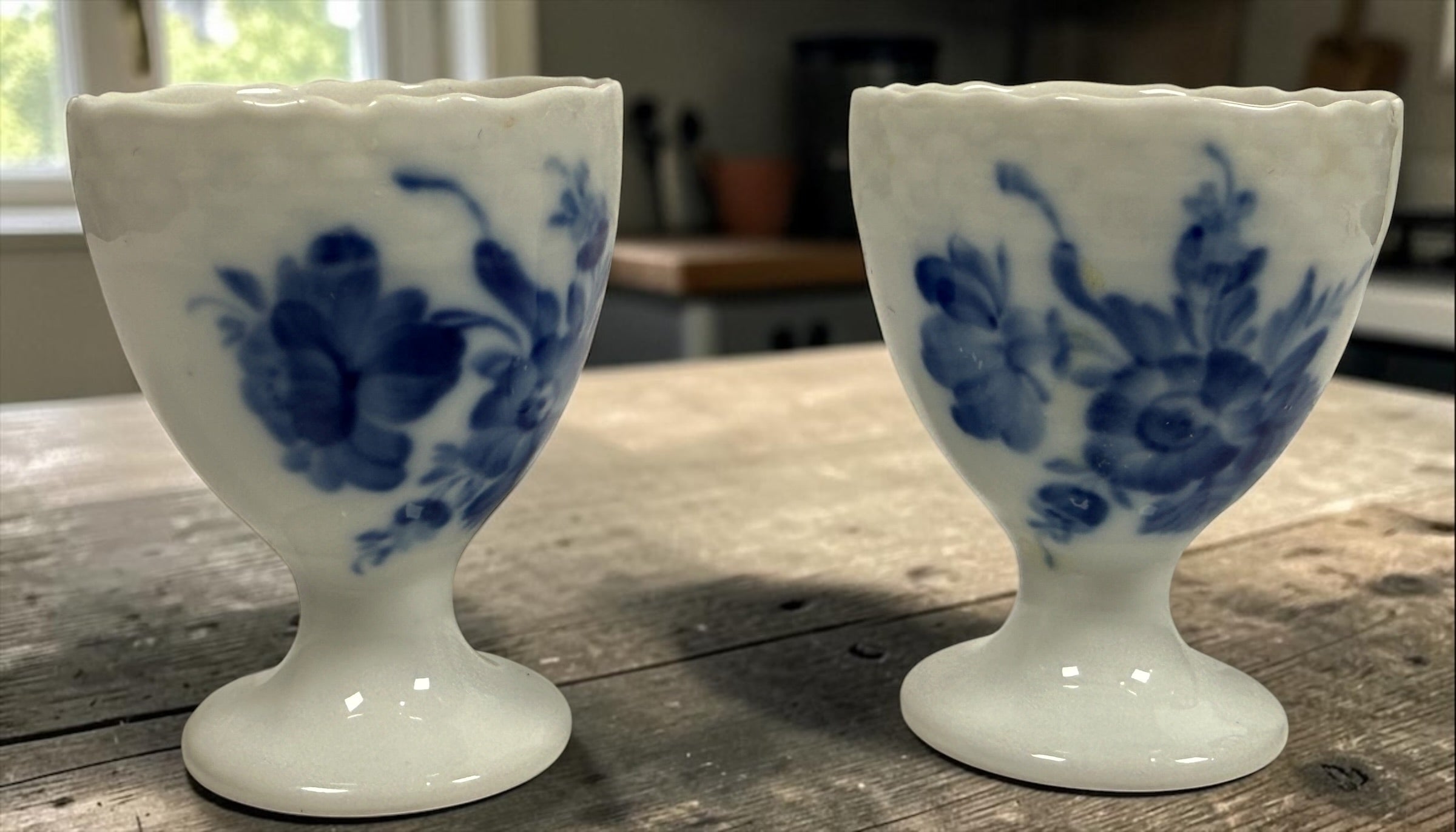 Vintage Royal Copenhagen Blue Flower 10/1568 porcelain egg cups, matching pair with hand-painted cobalt floral decoration, made in Denmark.