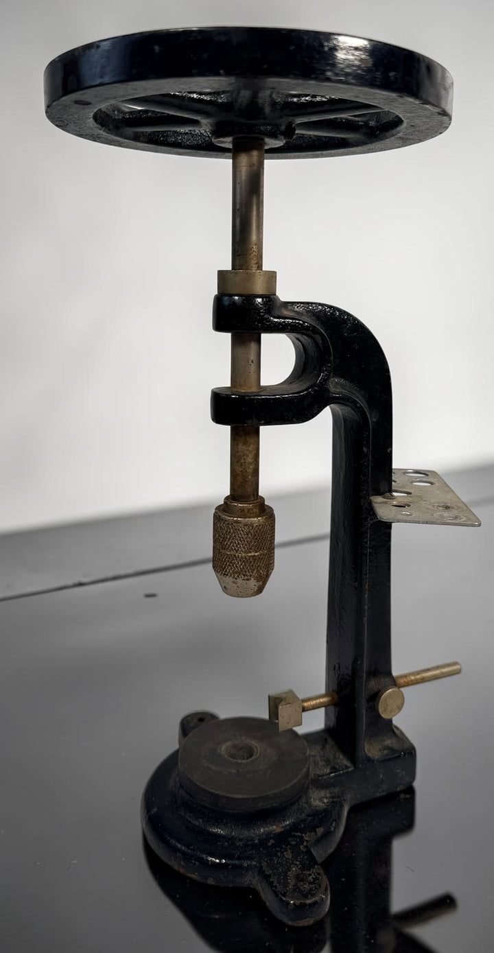 Vintage Fisher Scientific Montreal laboratory cork boring machine with cast-iron construction, handwheel and original maker plate. Collectible scientific apparatus.