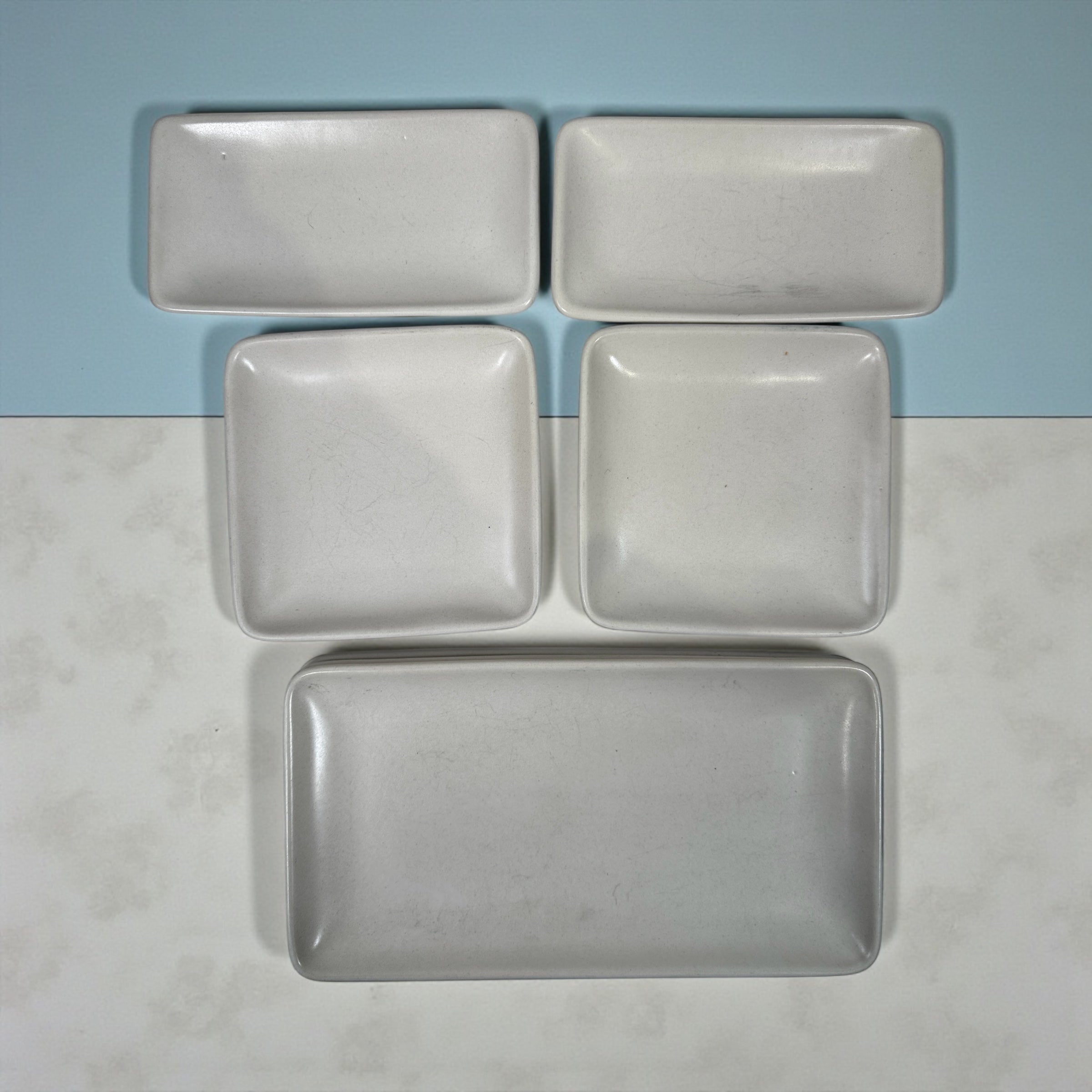 Heath Ceramics 7-piece stoneware serving set with modern matte white glaze. Restaurant-grade California design. Durable and collectible modern tableware.