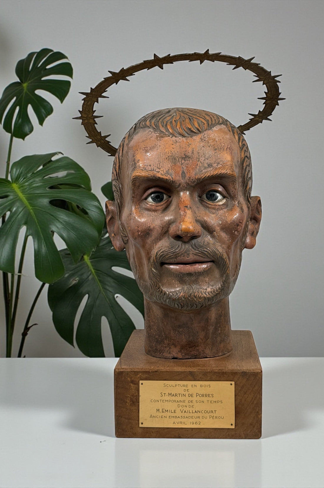 Wood bust of Saint Martin de Porres (1962) with diplomatic provenance from Canadian Ambassador in Peru. Glass eyes, halo, presentation plaque. Rare devotional art.