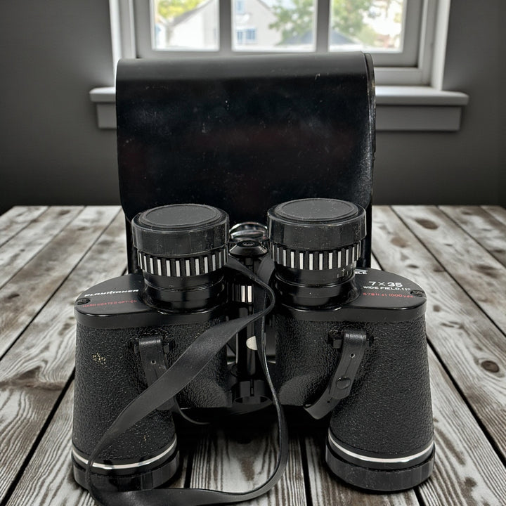 Vintage 7×35 wide-angle binoculars with case and caps. Clean optics, Japan made, 11-degree field. Ideal for birding, camping, cottage use. Complete and functional.