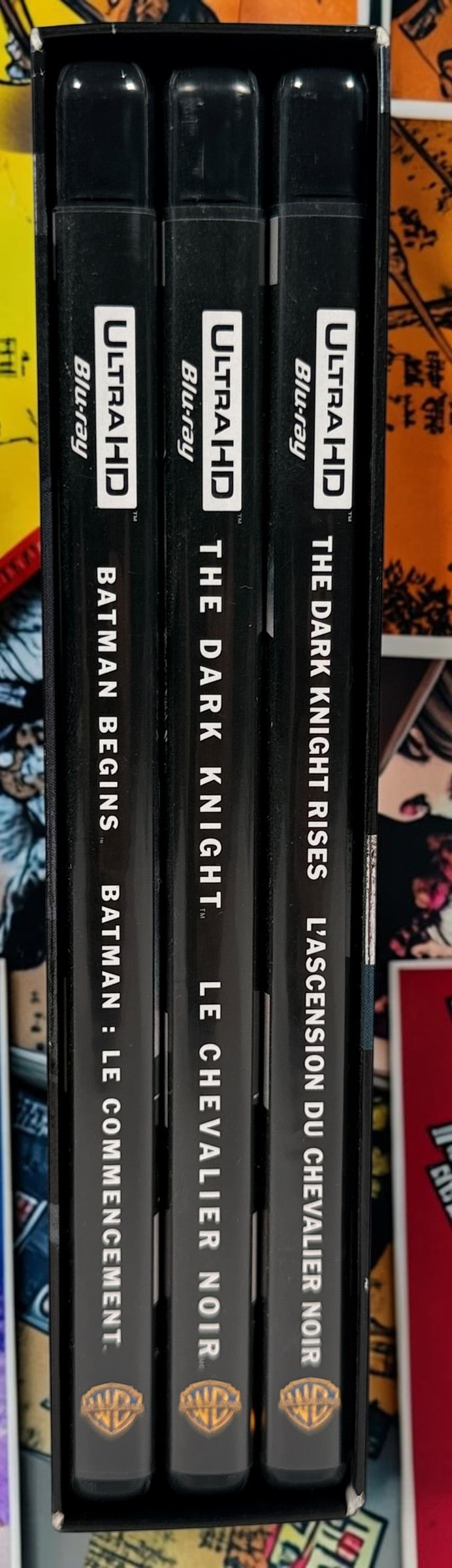 The Dark Knight Trilogy 4K UHD + Blu-ray box set with Batman Begins, The Dark Knight and Dark Knight Rises. Canadian bilingual edition.