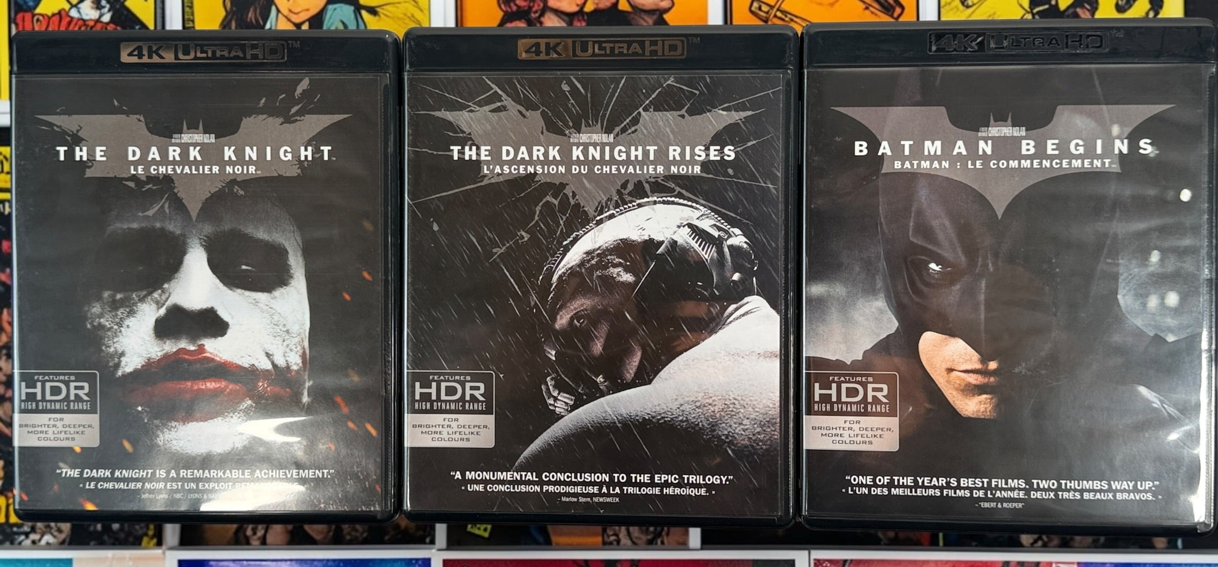 The Dark Knight Trilogy 4K UHD + Blu-ray box set with Batman Begins, The Dark Knight and Dark Knight Rises. Canadian bilingual edition.