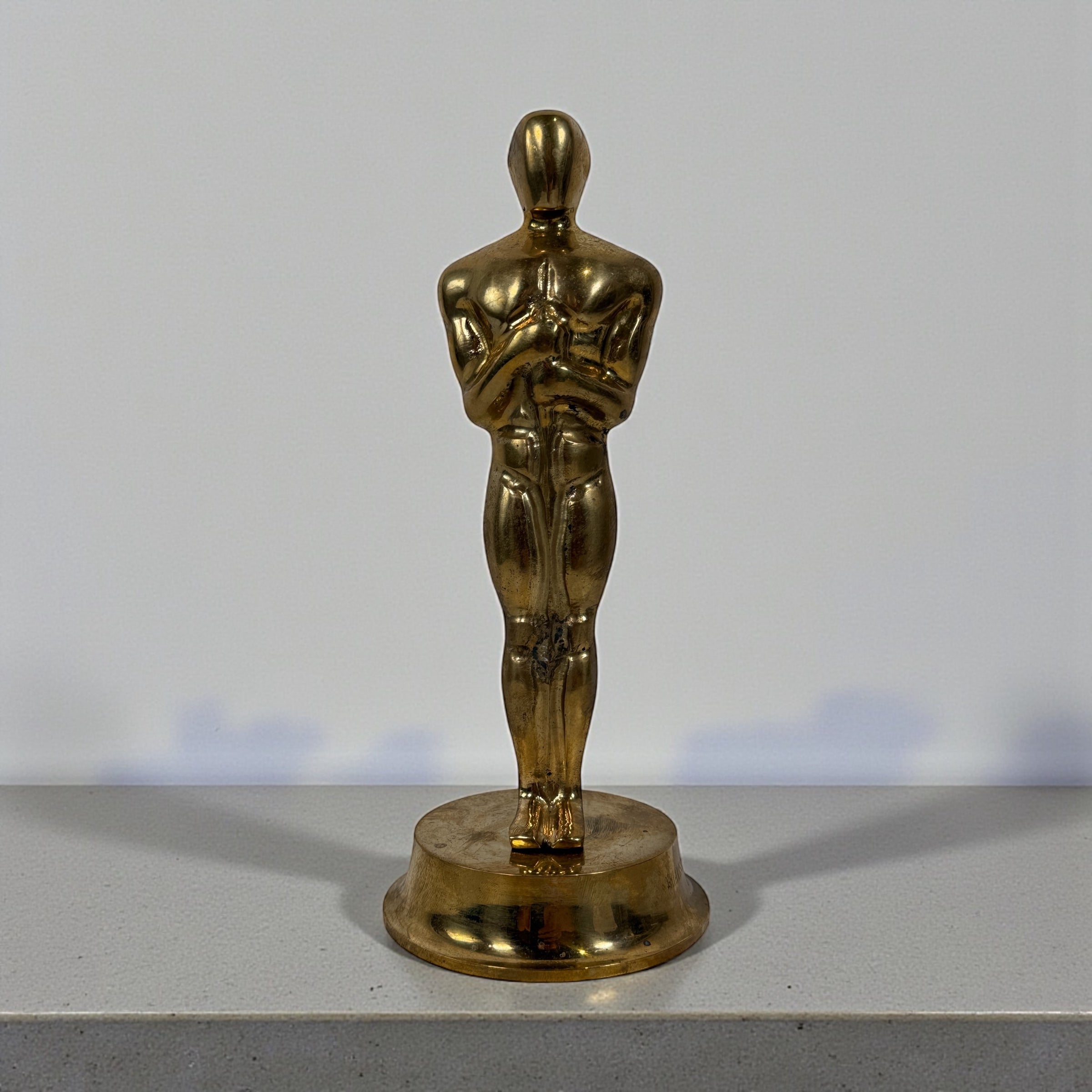 Vintage solid brass Oscar-style award statuette with engraved name. Ideal for display, props, themed events and awards season. Late 20th century.