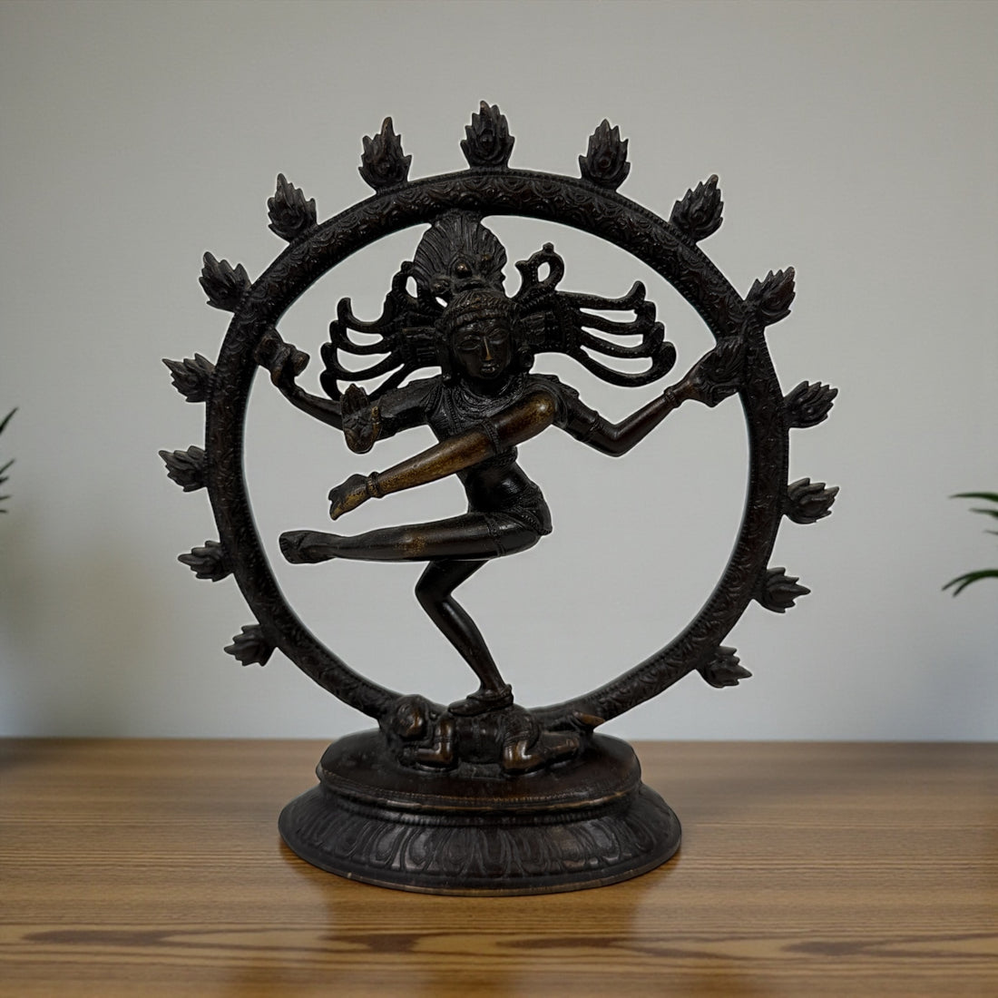 Indian Shiva Nataraja brass statue with cosmic ring of flames. Vintage devotional décor for altar, yoga or meditation spaces. Late 20th century. India.