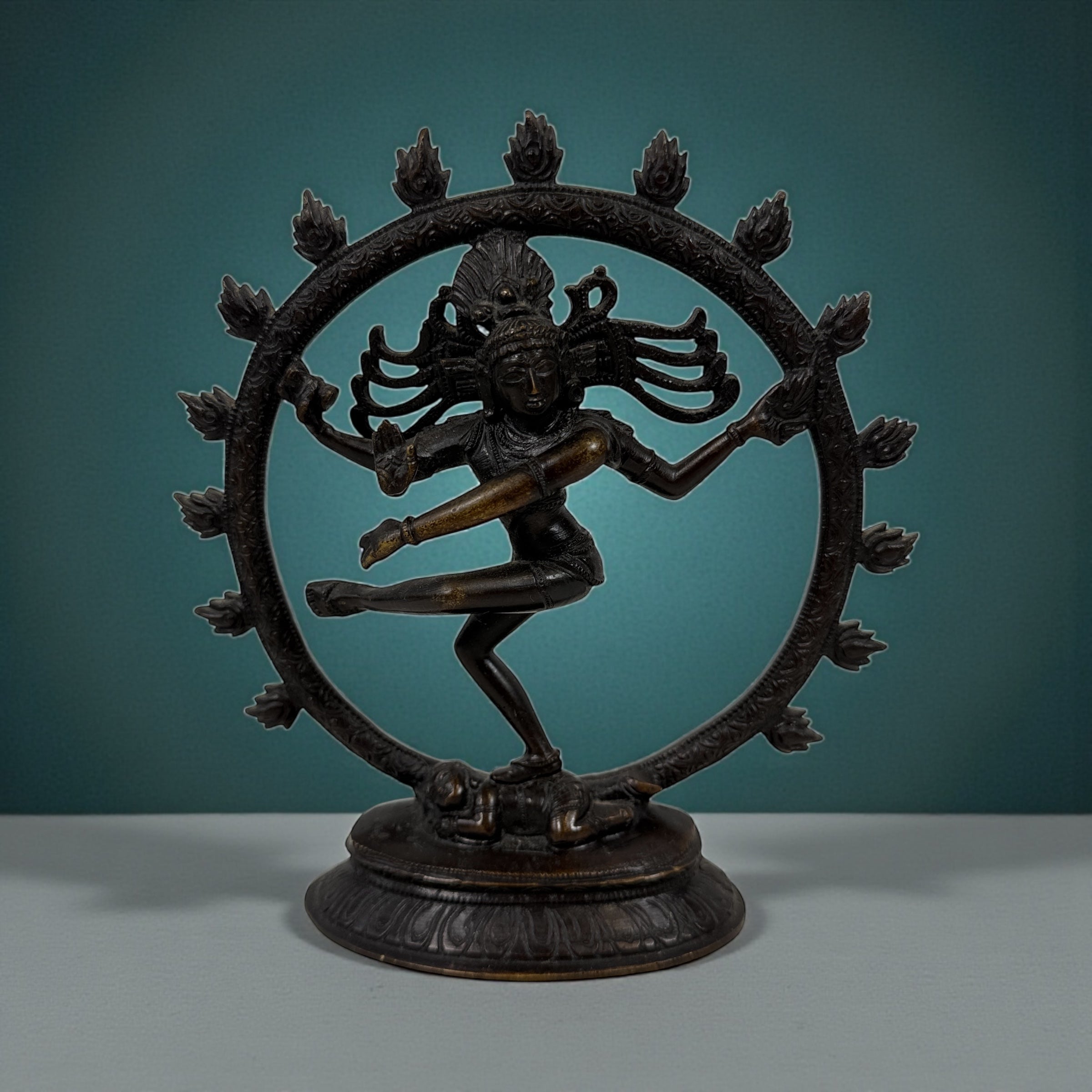 Indian Shiva Nataraja brass statue with cosmic ring of flames. Vintage devotional décor for altar, yoga or meditation spaces. Late 20th century. India.
