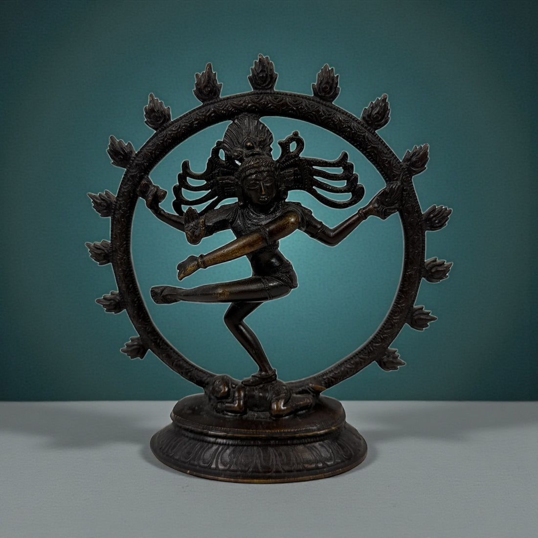 Indian Shiva Nataraja brass statue with cosmic ring of flames. Vintage devotional décor for altar, yoga or meditation spaces. Late 20th century. India.