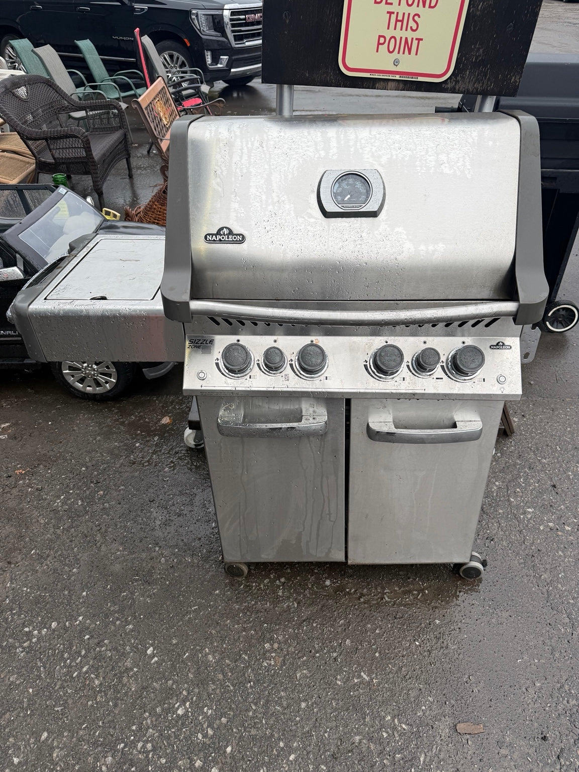 Original front view of used Napoleon 500RSIB stainless steel BBQ with right shelf missing