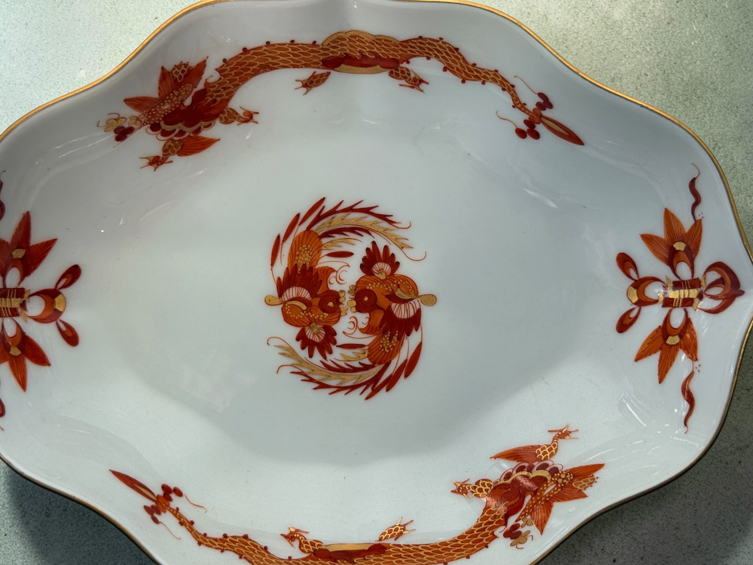 Vintage Meissen Red Dragon oval porcelain dish with gold trim and scalloped edges. Measures 6 × 4.5 inches. Collectible German porcelain.