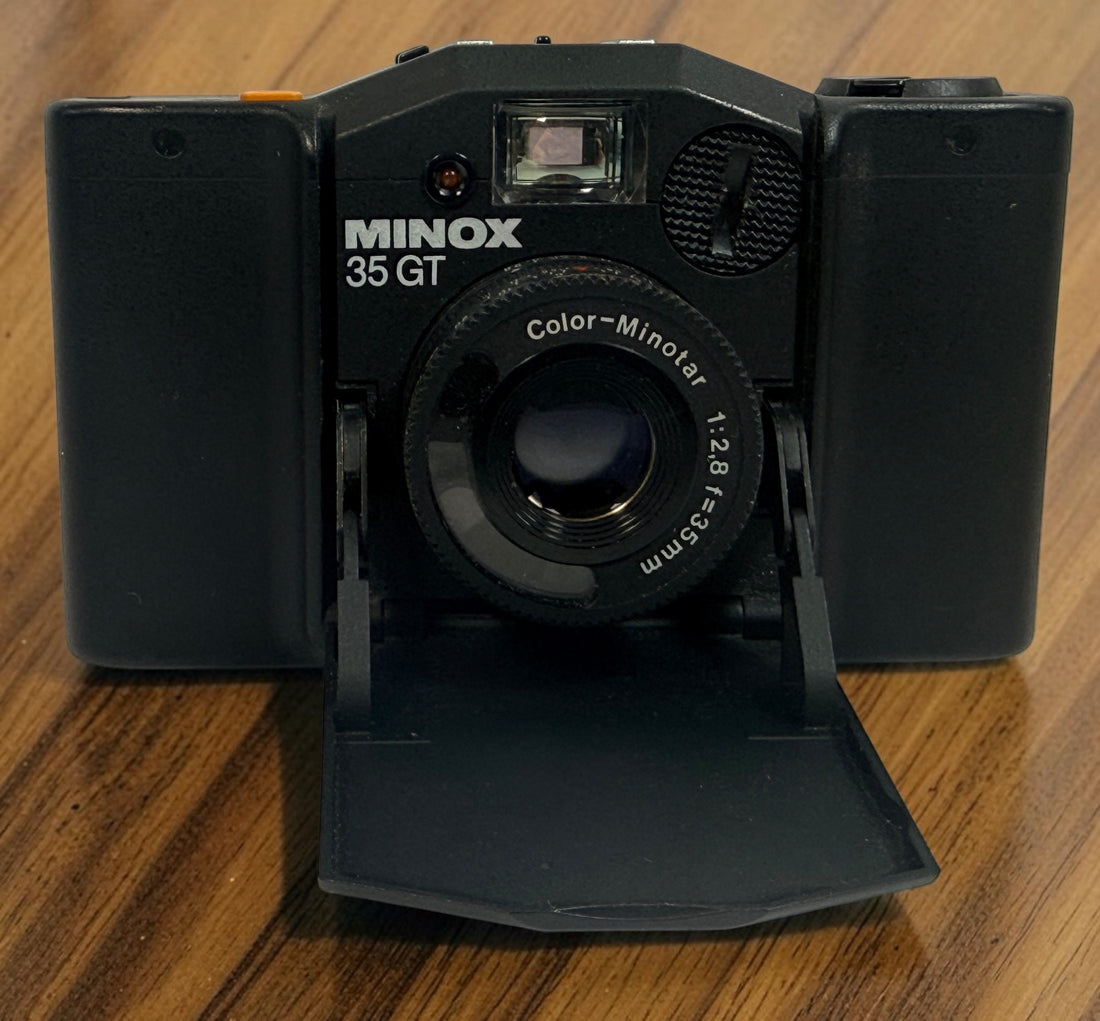 SEO Meta Description: Vintage Minox 35 GT 35mm film camera with Color-Minotar f/2.8 lens, original case and manual. Made in West Germany. Untested vintage collectible.