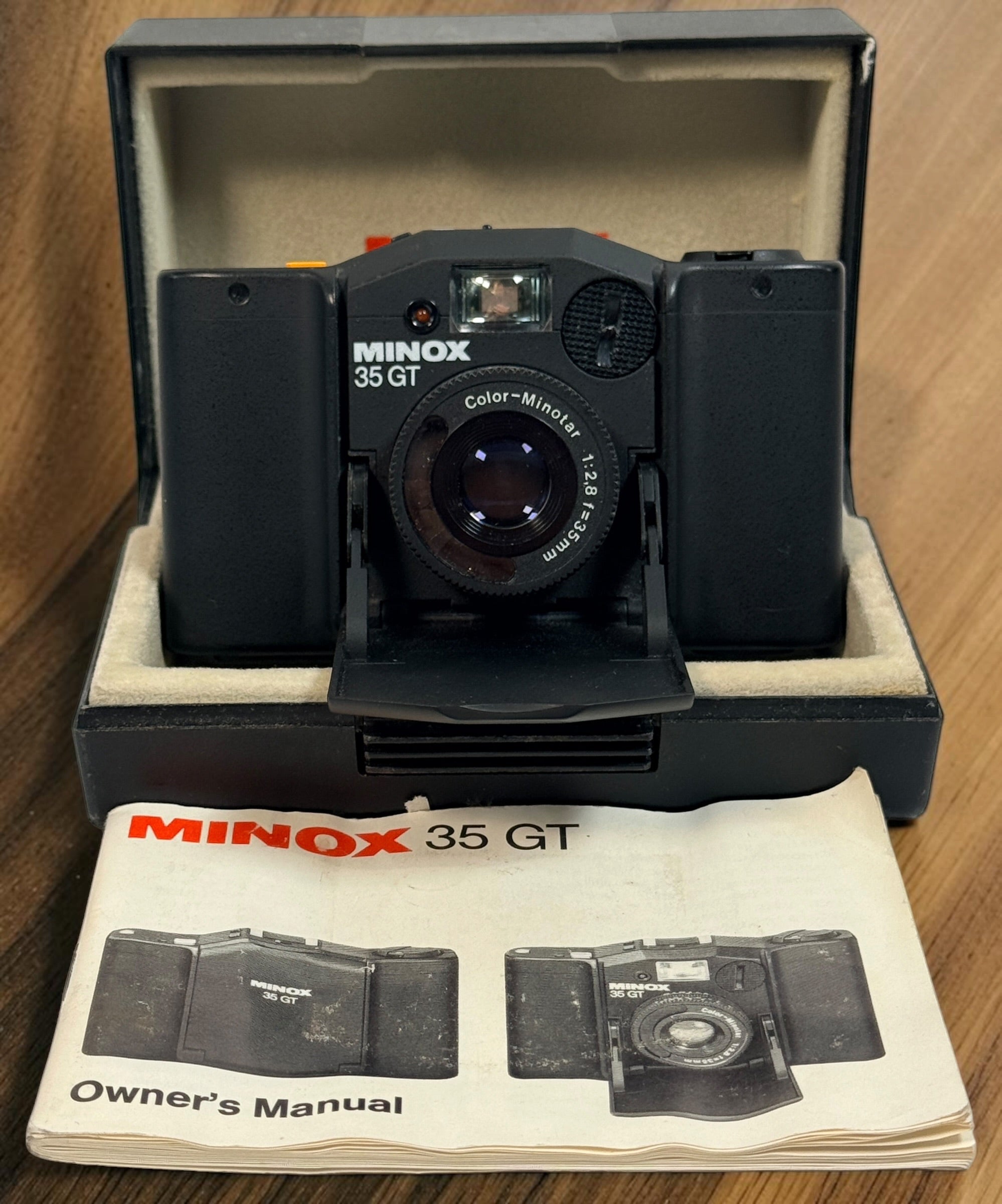 SEO Meta Description: Vintage Minox 35 GT 35mm film camera with Color-Minotar f/2.8 lens, original case and manual. Made in West Germany. Untested vintage collectible.