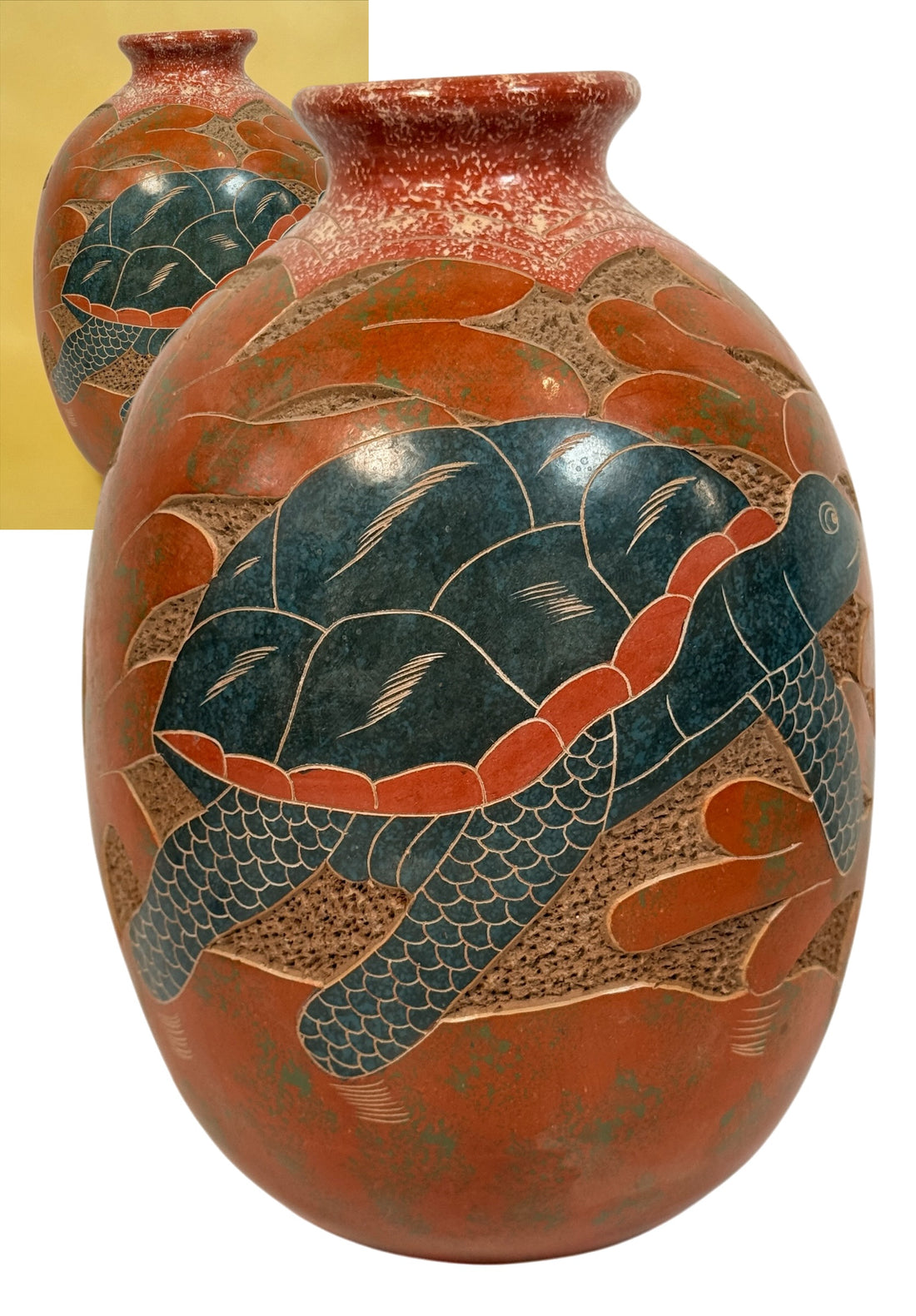 Decorative signed Latin American pottery vase featuring a carved sea turtle, terracotta finish and intricate sgraffito-style detailing.