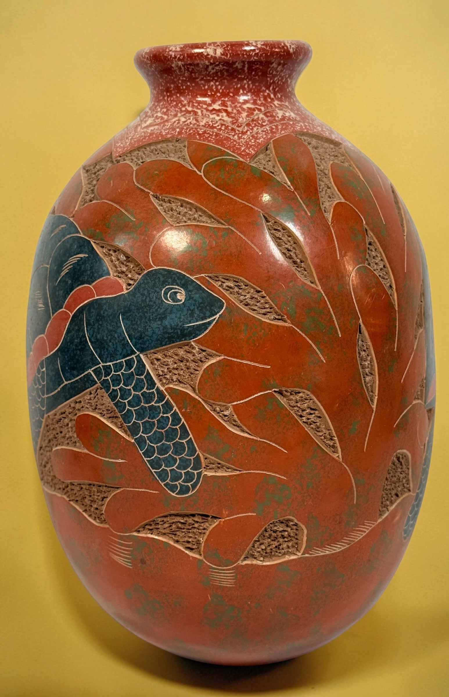 Decorative signed Latin American pottery vase featuring a carved sea turtle, terracotta finish and intricate sgraffito-style detailing.
