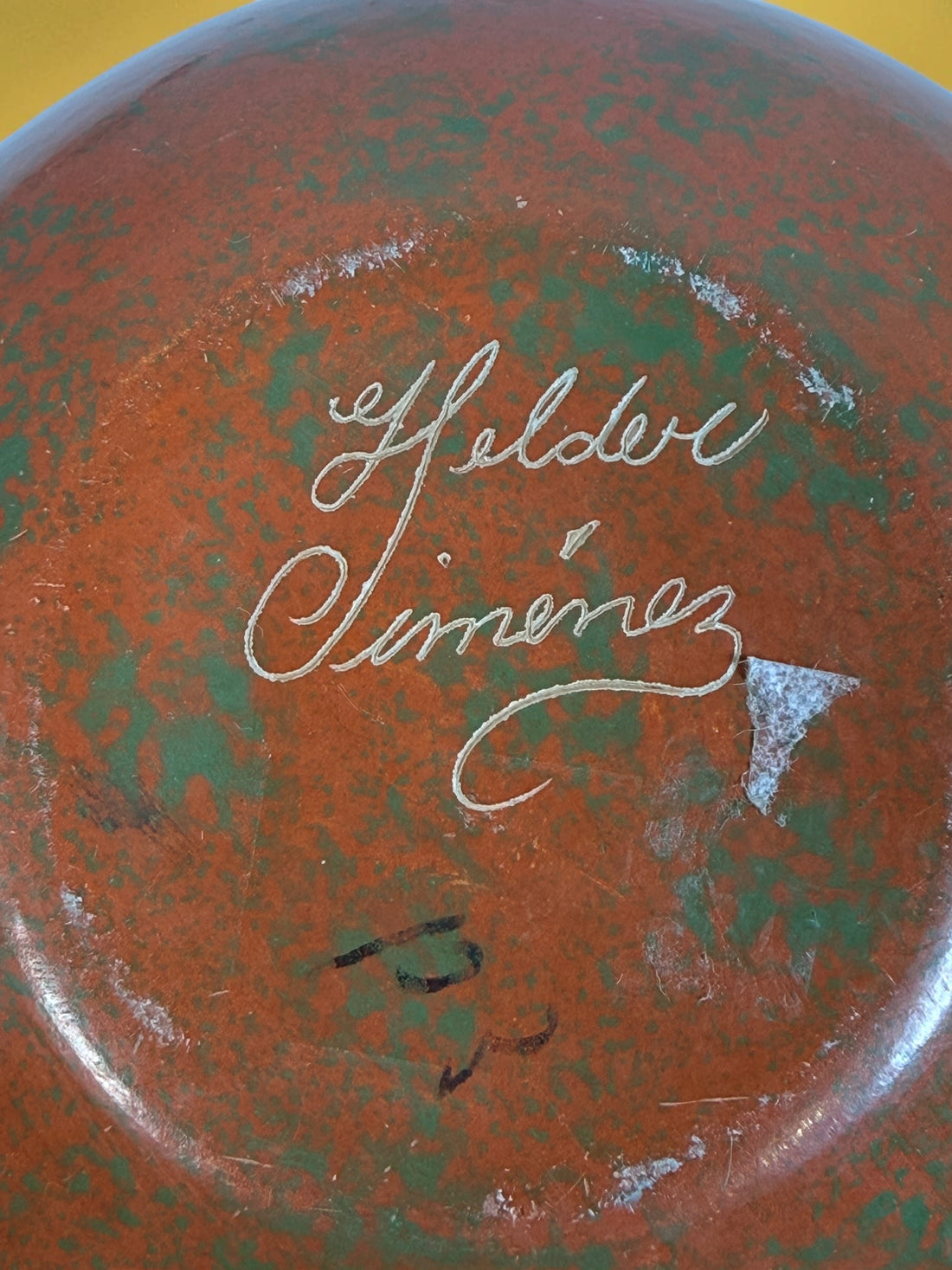 Decorative signed Latin American pottery vase featuring a carved sea turtle, terracotta finish and intricate sgraffito-style detailing.