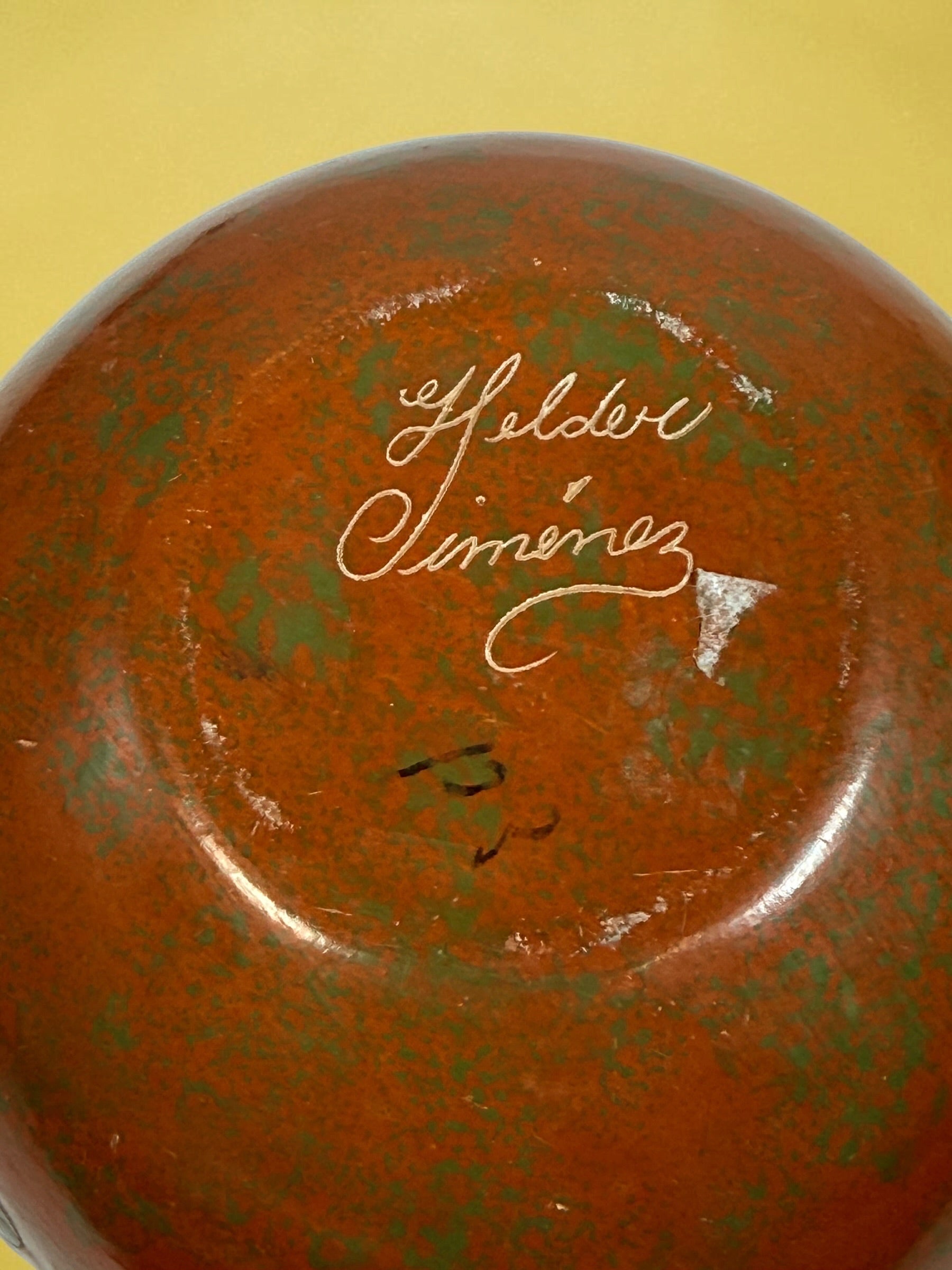 Decorative signed Latin American pottery vase featuring a carved sea turtle, terracotta finish and intricate sgraffito-style detailing.
