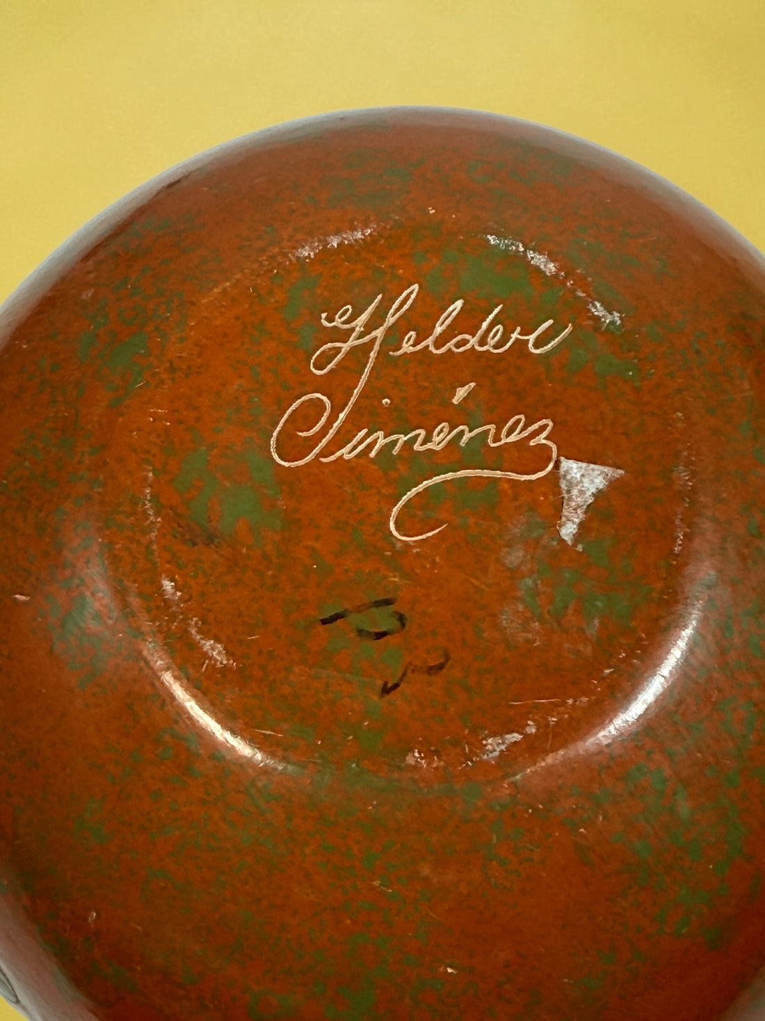 Decorative signed Latin American pottery vase featuring a carved sea turtle, terracotta finish and intricate sgraffito-style detailing.