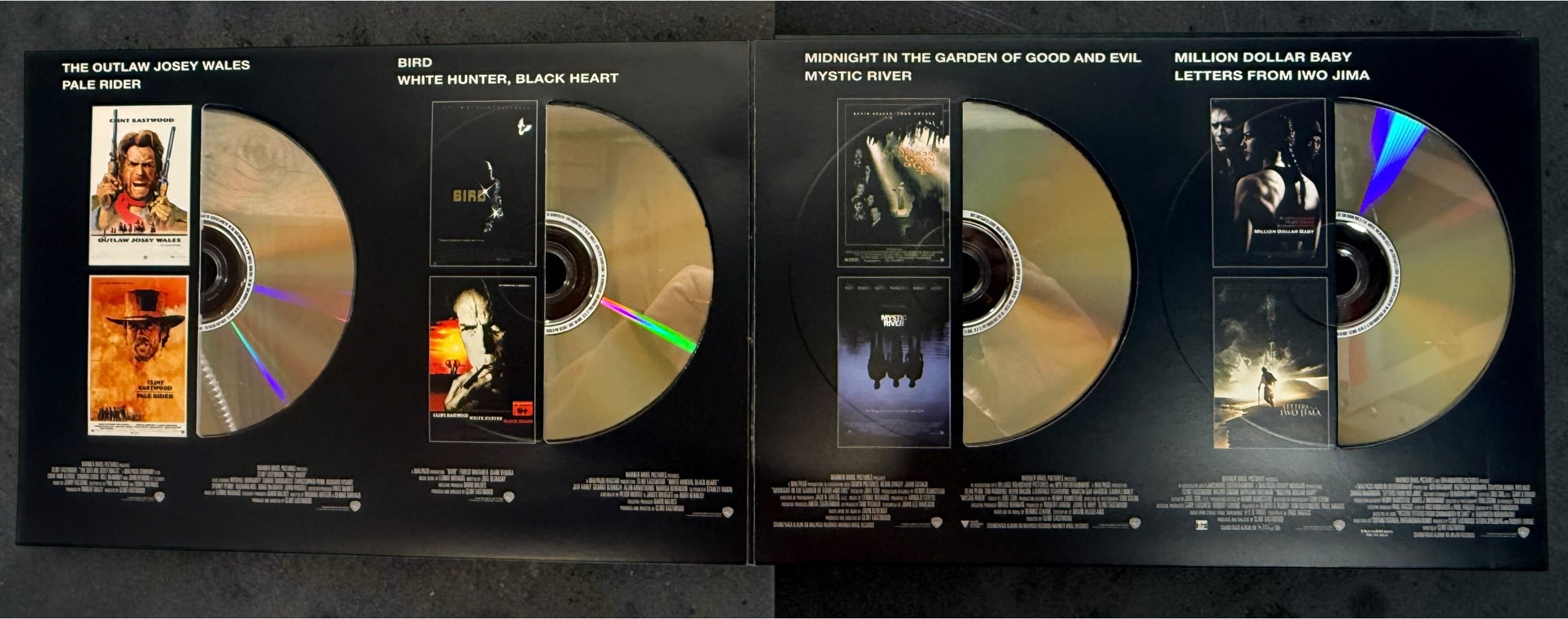Clint Eastwood 40-Film Collection on 24 DVDs with illustrated collector's case and hardcover companion book. Pre-owned Warner Bros. movie box set.