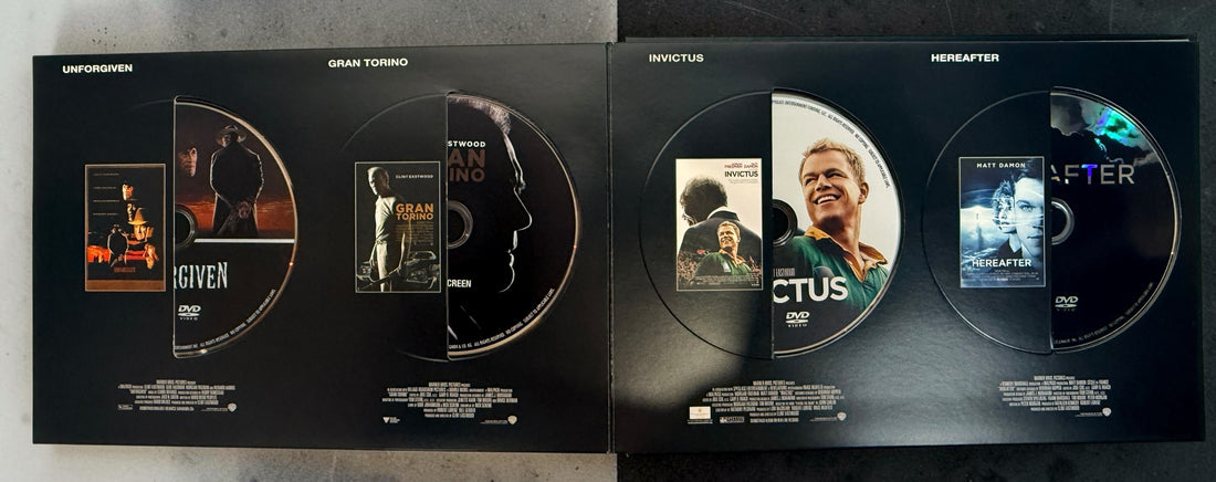 Clint Eastwood 40-Film Collection on 24 DVDs with illustrated collector's case and hardcover companion book. Pre-owned Warner Bros. movie box set.