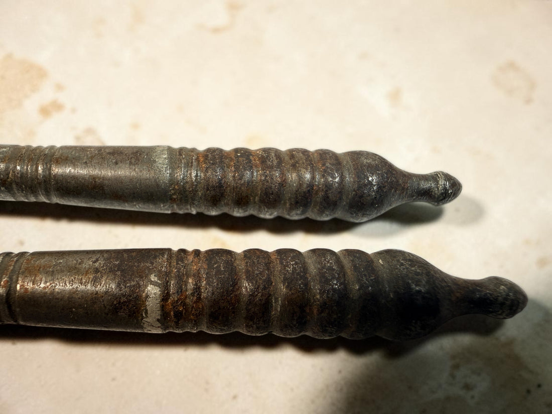 Antique Victorian reversible double nutcracker in iron with decorative handles and textured jaws. Collectible 19th-century kitchen tool.