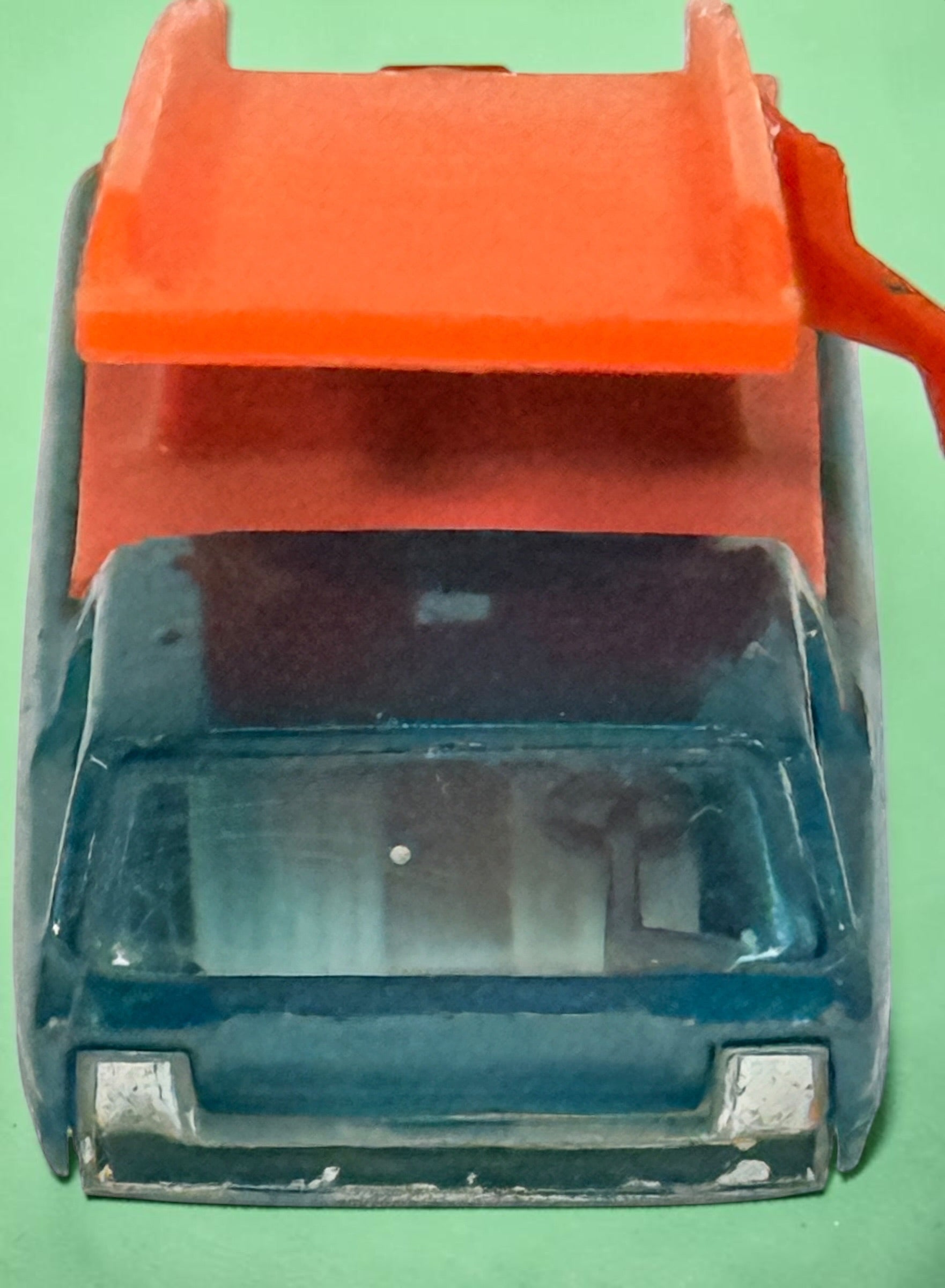 Vintage Hot Wheels Sky Show Deora with orange launcher, metallic blue-green finish and Hong Kong base. Redline-era Mattel collectible; airplane missing.