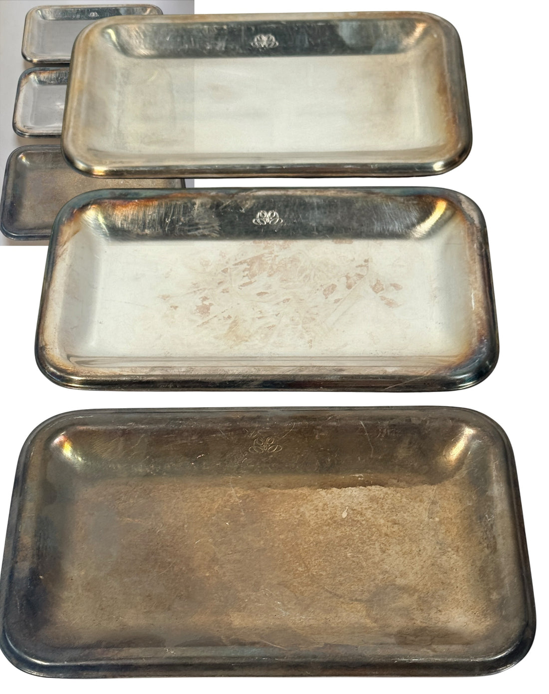  Set of three vintage Sambonet silver-plated trays made in Italy. Rectangular trays with decorative emblems and visible vintage wear.