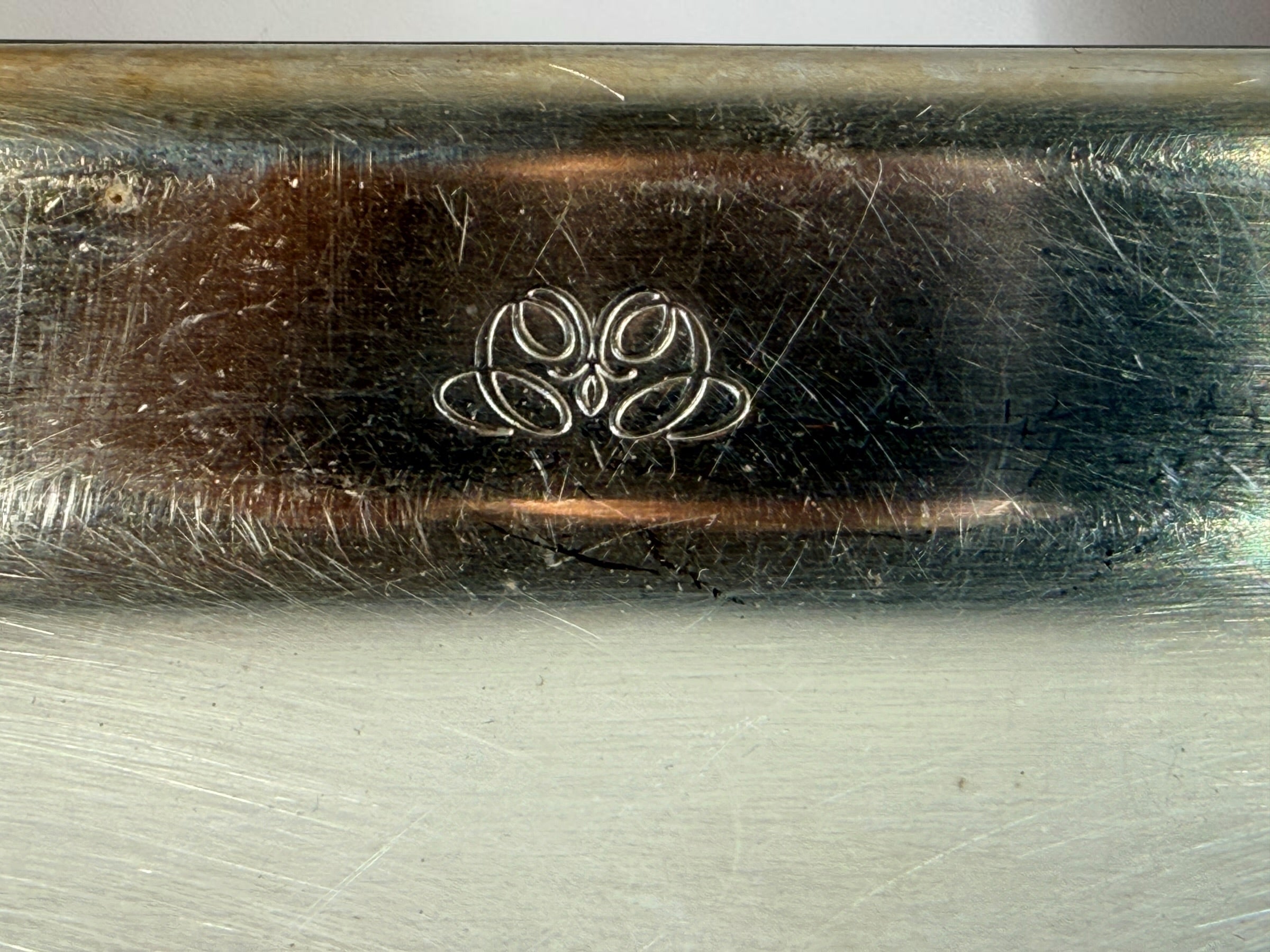  Set of three vintage Sambonet silver-plated trays made in Italy. Rectangular trays with decorative emblems and visible vintage wear.