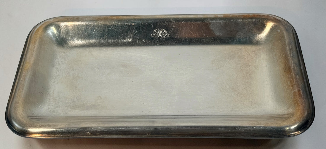  Set of three vintage Sambonet silver-plated trays made in Italy. Rectangular trays with decorative emblems and visible vintage wear.