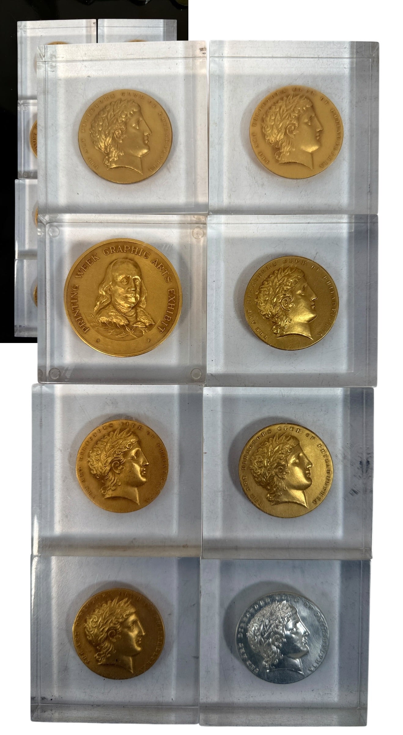 Explore eight vintage graphic arts awards associated with Frank Zachary, including a 1962 Philadelphia Printing Week medallion