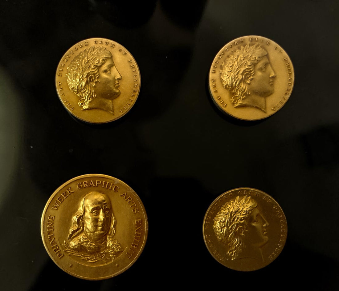 Explore eight vintage graphic arts awards associated with Frank Zachary, including a 1962 Philadelphia Printing Week medallion