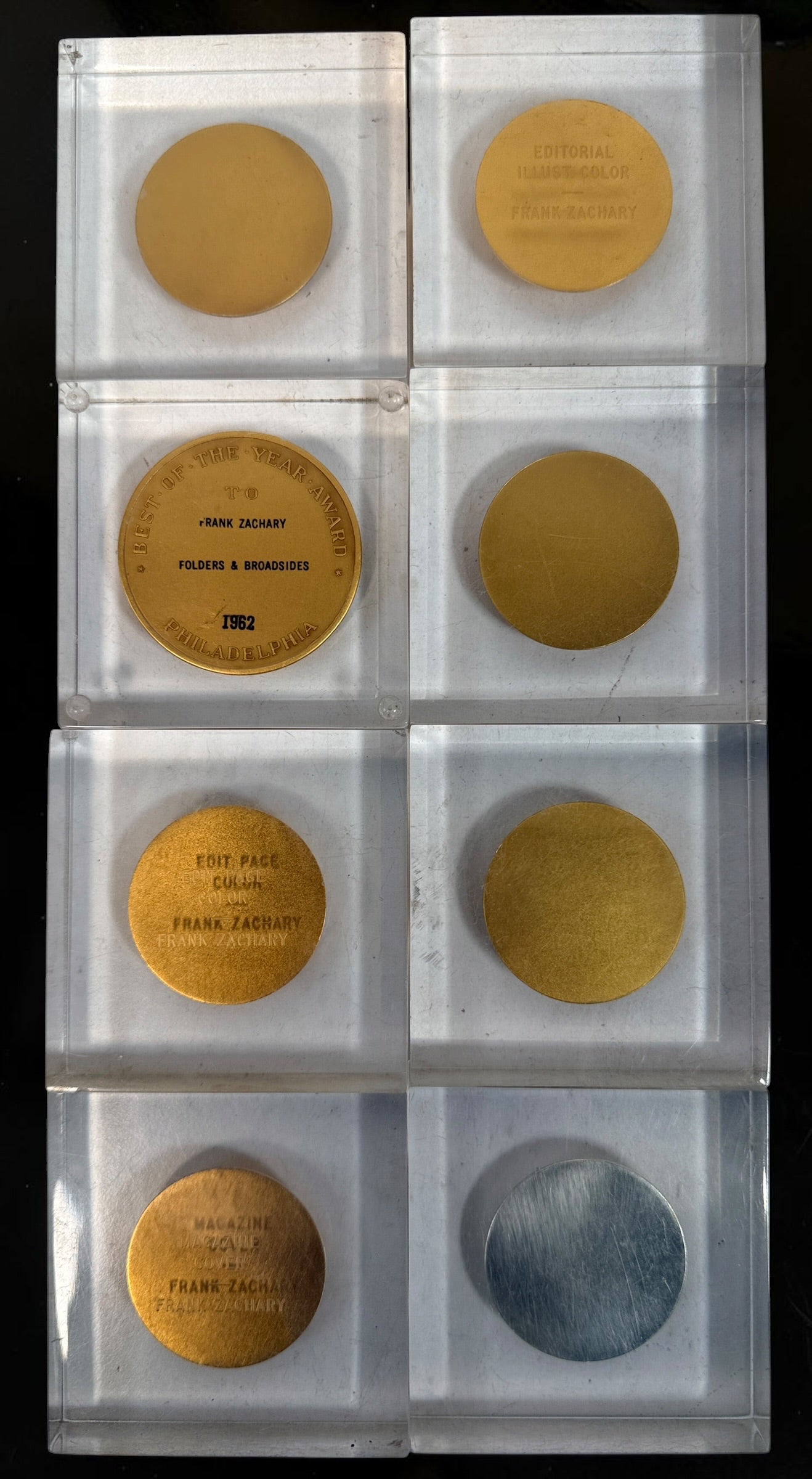 Explore eight vintage graphic arts awards associated with Frank Zachary, including a 1962 Philadelphia Printing Week medallion