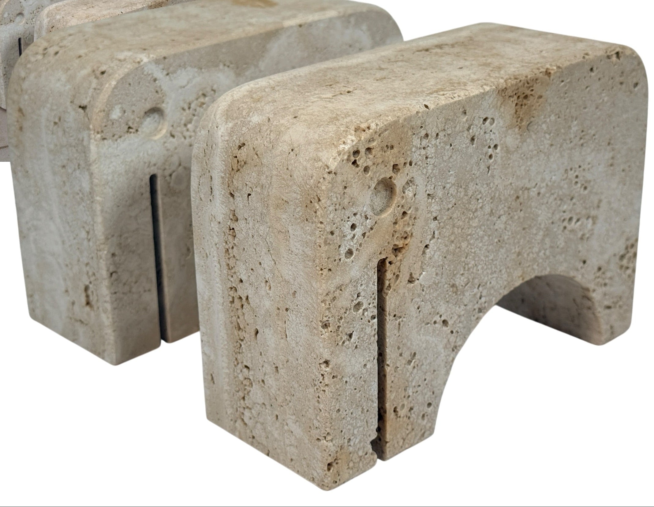Pair of travertine elephant bookends attributed to Fratelli Mannelli. Sculptural mid-century modern style with warm, naturally textured stone