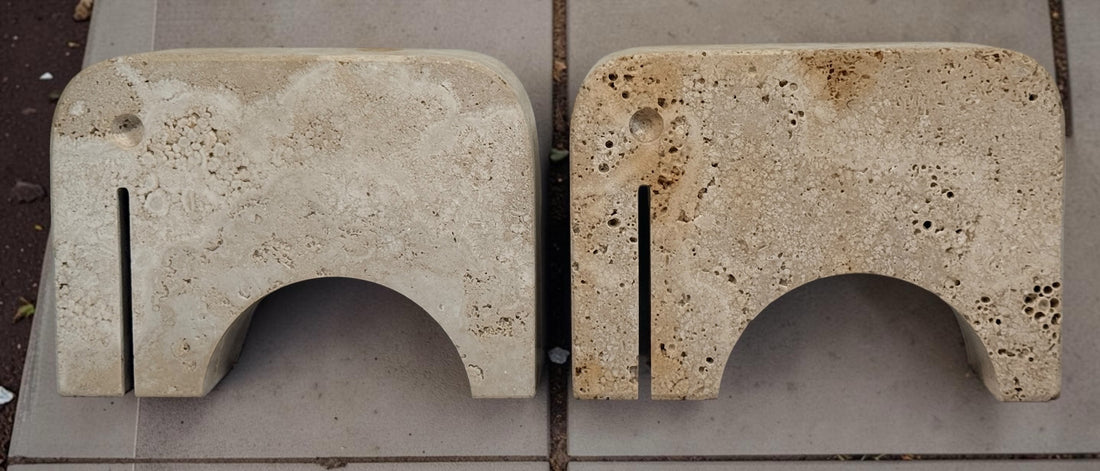 Pair of travertine elephant bookends attributed to Fratelli Mannelli. Sculptural mid-century modern style with warm, naturally textured stone