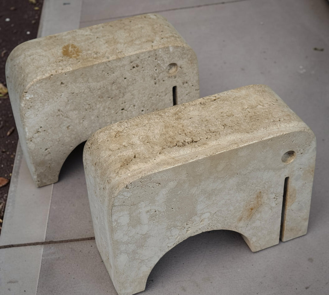 Pair of travertine elephant bookends attributed to Fratelli Mannelli. Sculptural mid-century modern style with warm, naturally textured stone