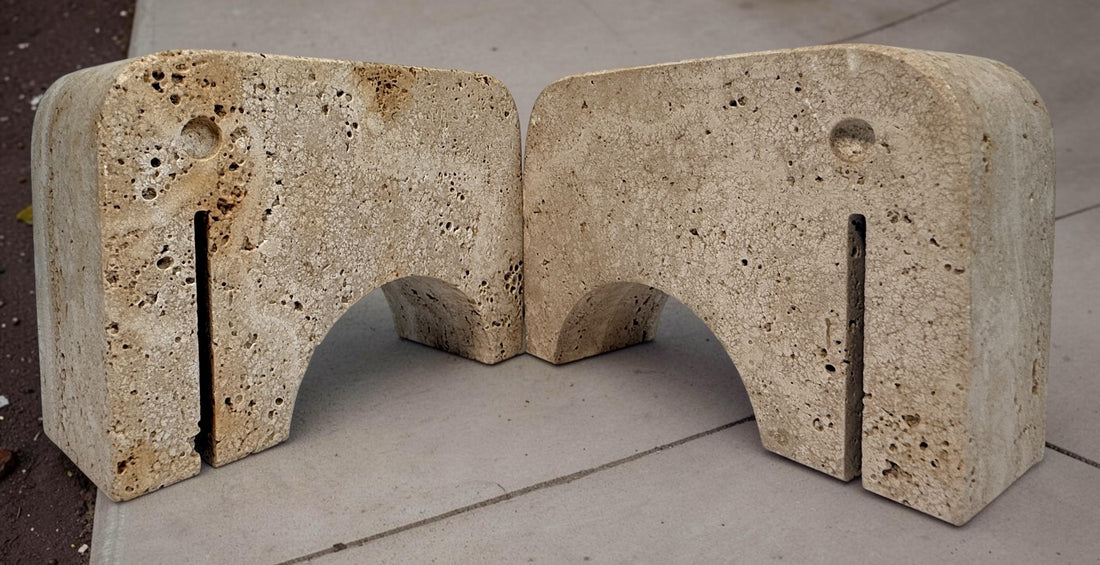 Pair of travertine elephant bookends attributed to Fratelli Mannelli. Sculptural mid-century modern style with warm, naturally textured stone