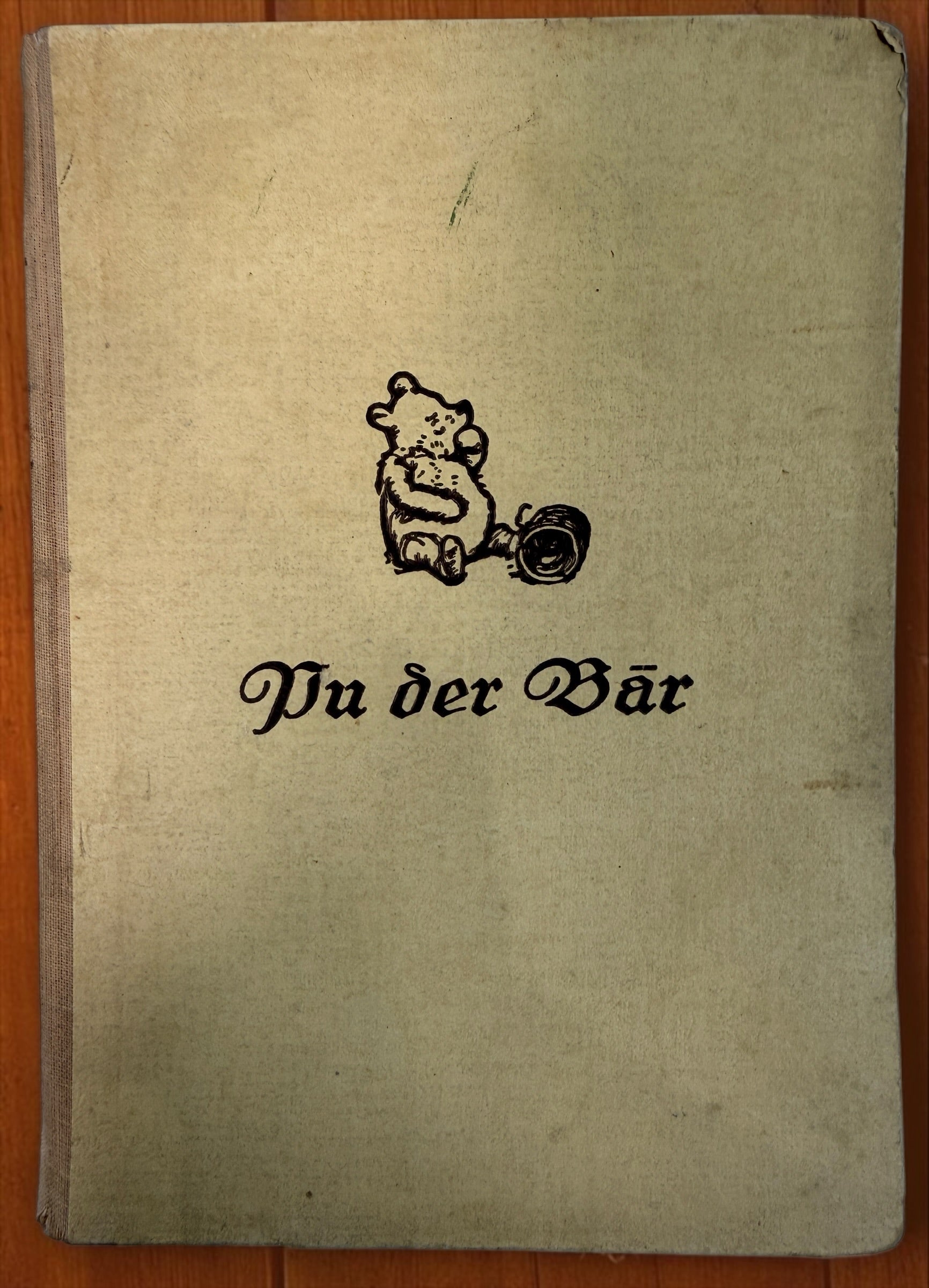 Discover a vintage German edition of Pu der Bär by A. A. Milne, illustrated by E. H. Shepard. Undated hardcover with visible age and wear.