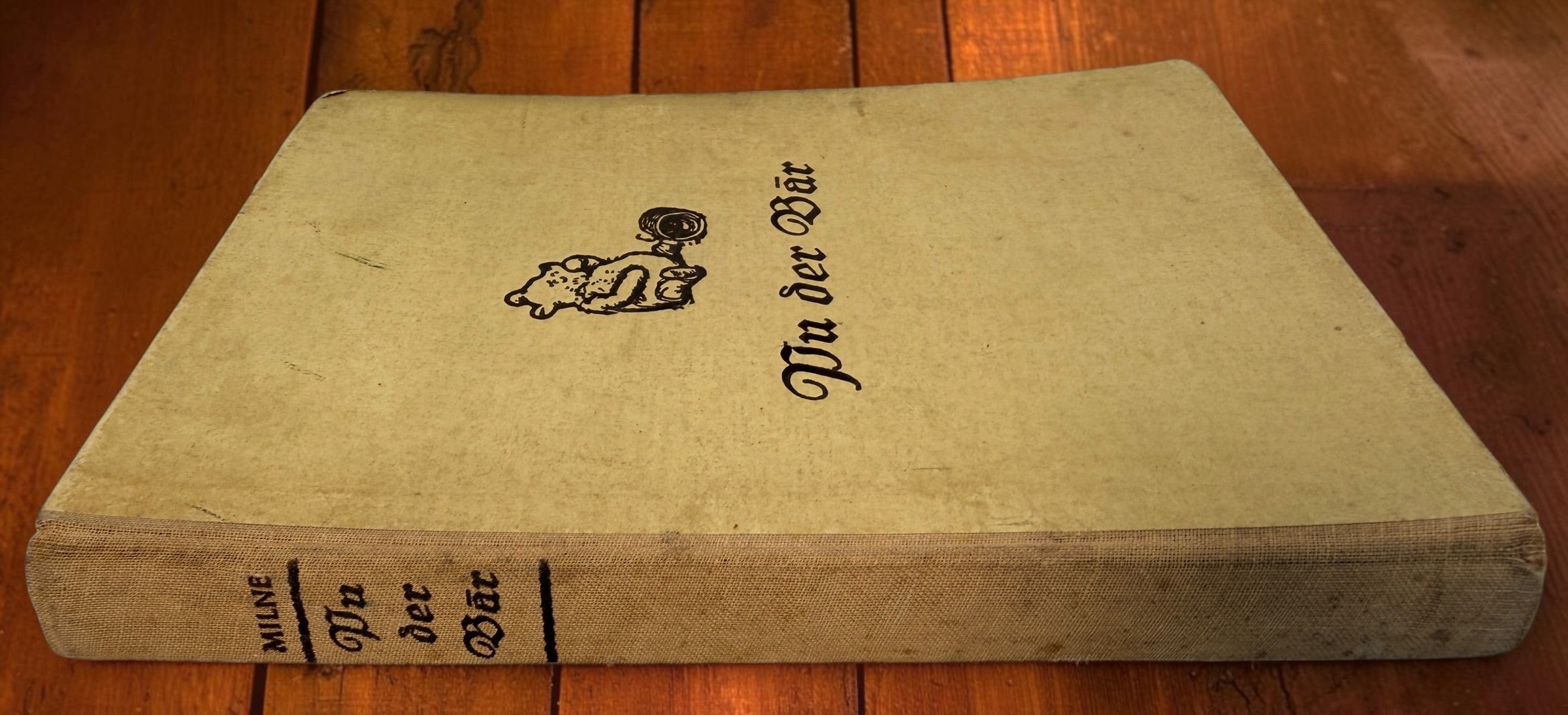 Discover a vintage German edition of Pu der Bär by A. A. Milne, illustrated by E. H. Shepard. Undated hardcover with visible age and wear.