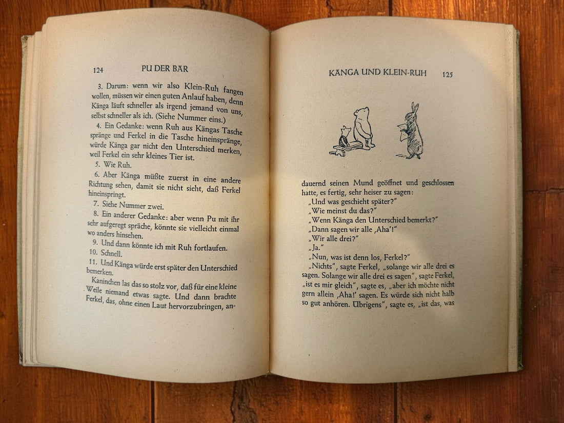 Discover a vintage German edition of Pu der Bär by A. A. Milne, illustrated by E. H. Shepard. Undated hardcover with visible age and wear.