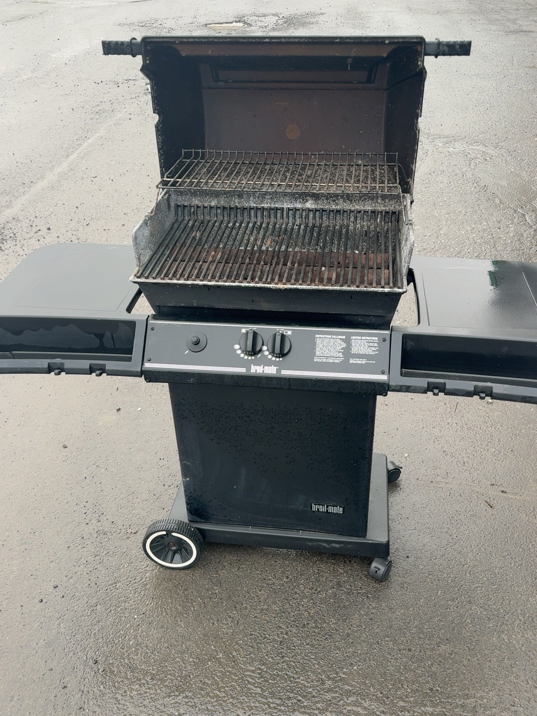 Used Broil-Mate BBQ with lid open, showing cooking grates and visible wear and rust
