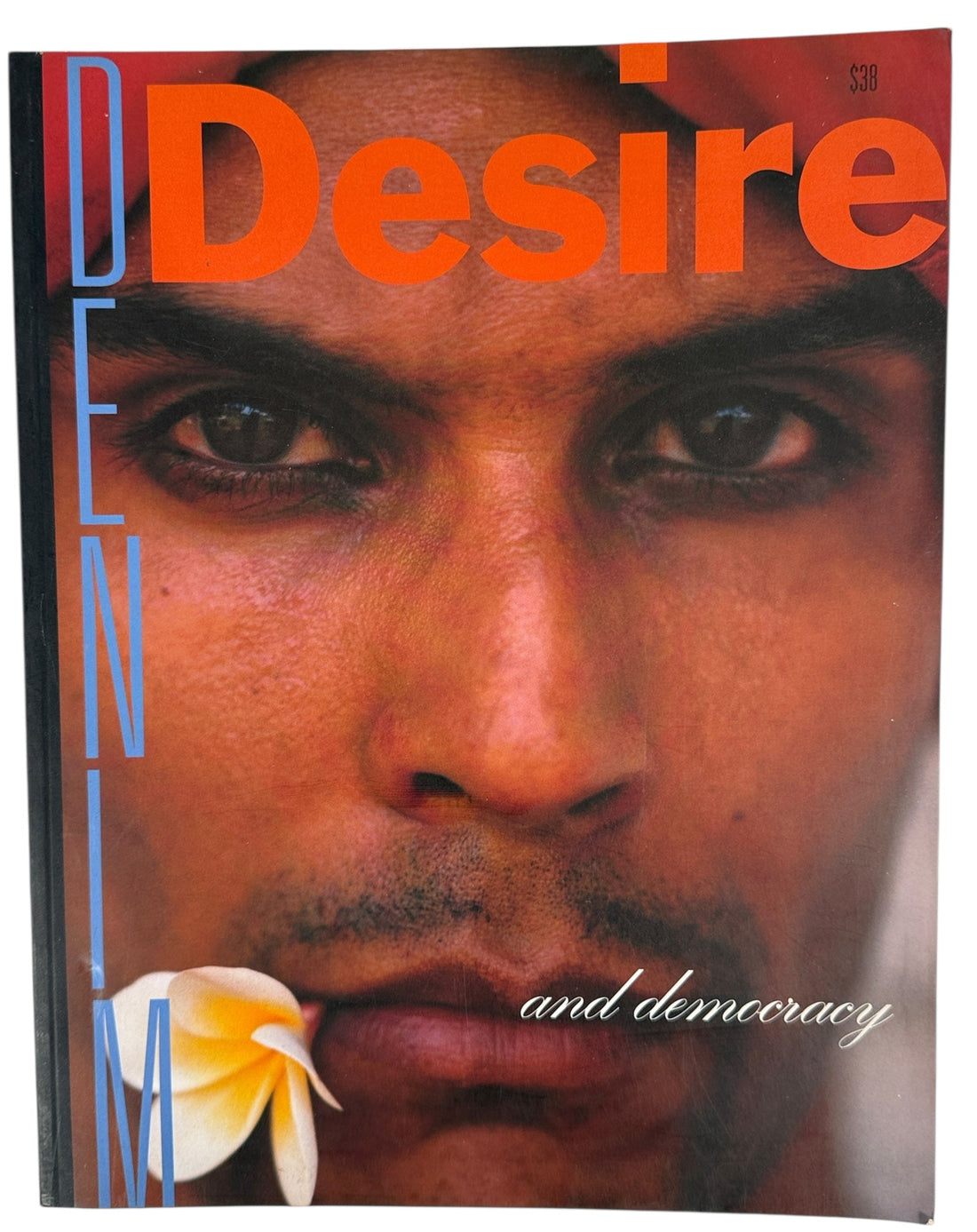 Book cover with a close-up of a person's face and the word 'Desire' in large orange letters.
