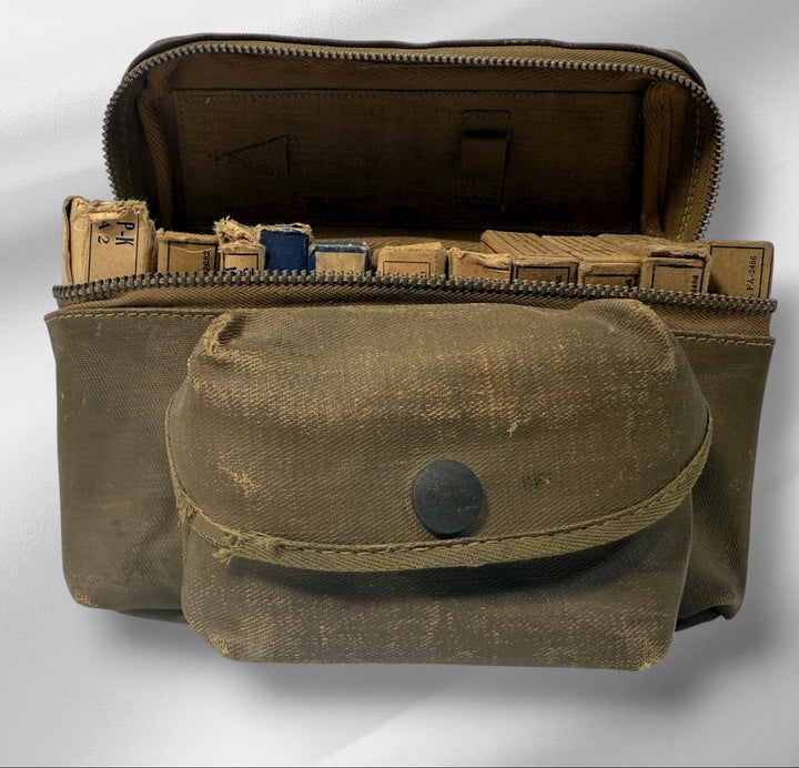Brown military-style pouch with a smaller pouch inside on a light gray background